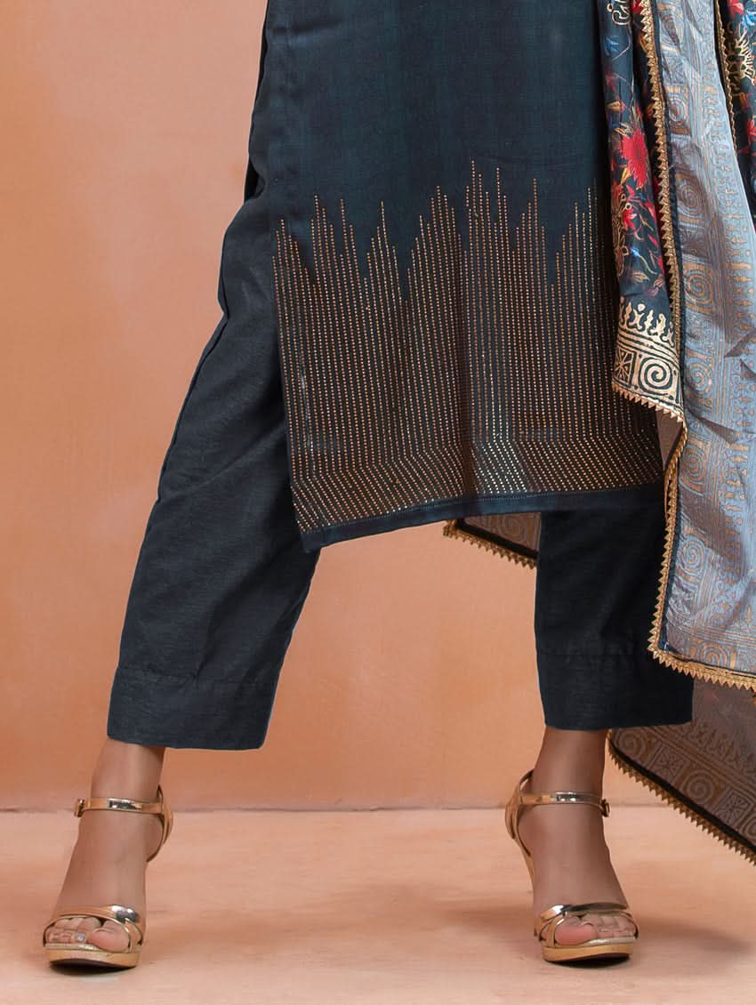 Black traditional outfit with intricate detailing on a beige background