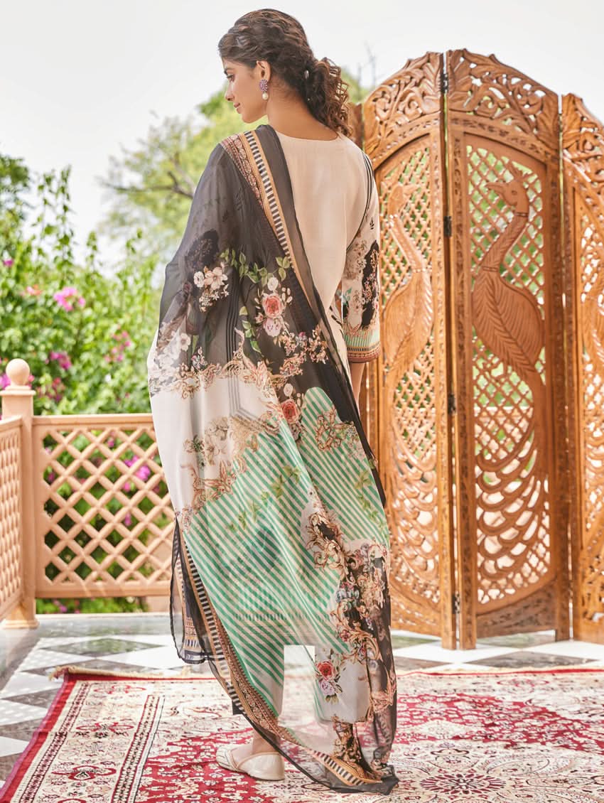 A woman wearing a traditional digital printed silk suit set with a dupatta, featuring a round neckline, three-fourth sleeves, and side slits. The set has a vibrant floral design.