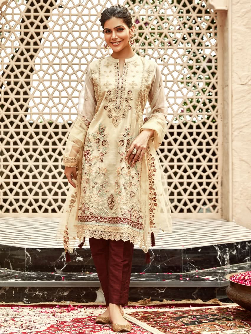 Cream embroidered organza silk suit set with long kurta, maroon pants, and sheer dupatta