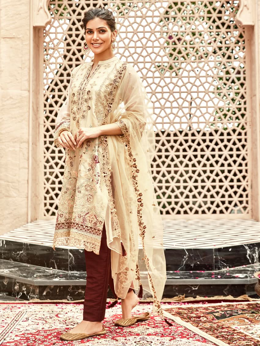 Cream embroidered kurta with sheer organza dupatta and maroon straight pants