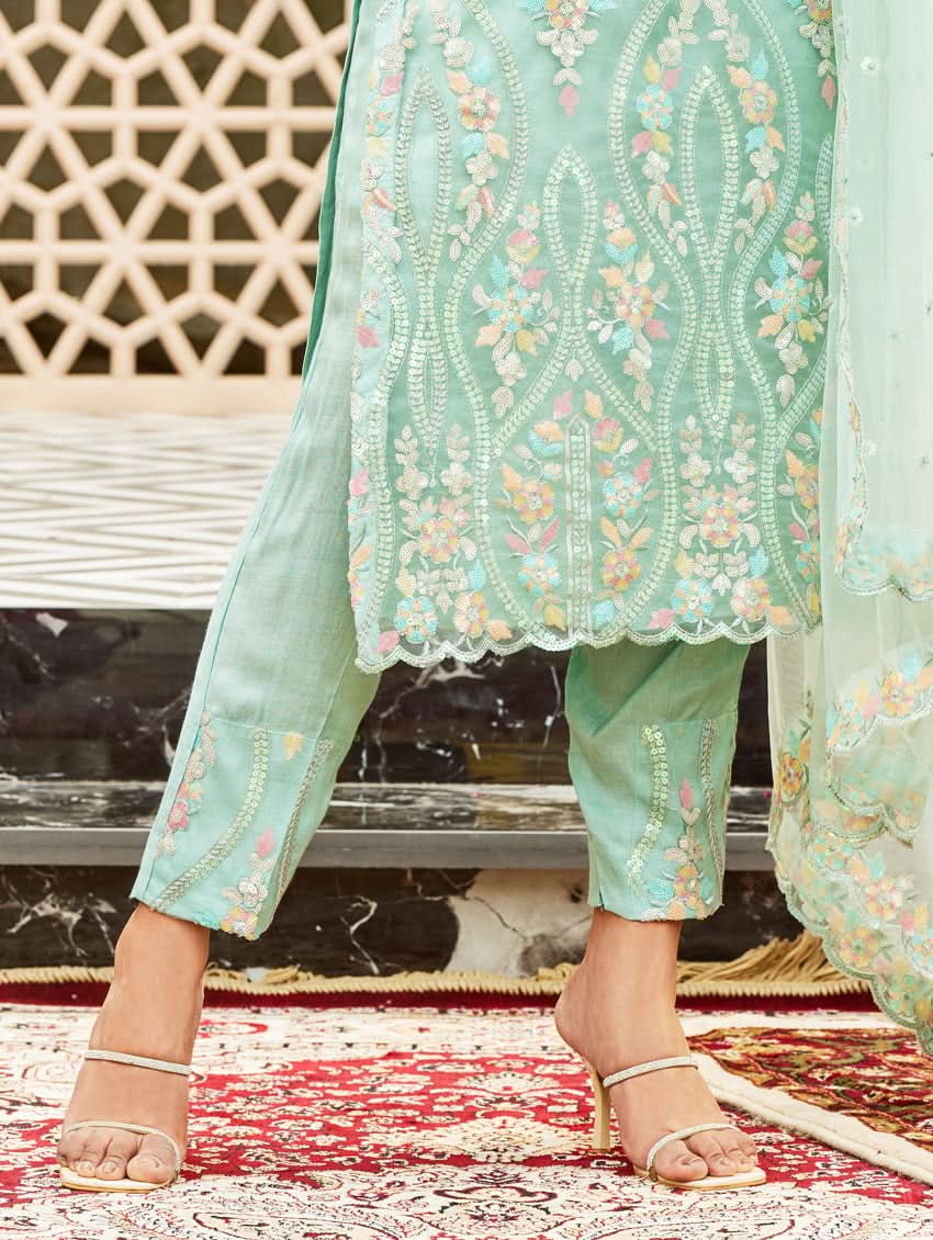 Light teal embroidered straight pants with floral motifs and sheer dupatta edge