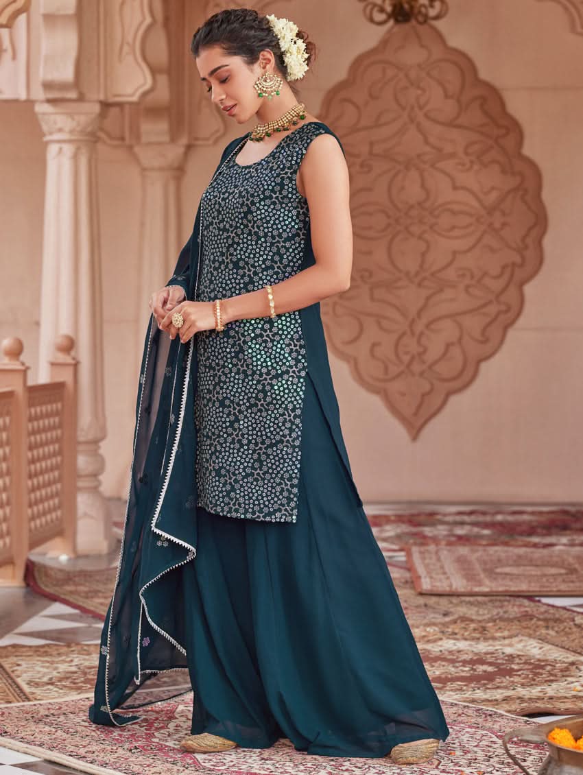 Embroidered dark teal sharara suit set with sleeveless tunic, flared pants, draped dupatta
