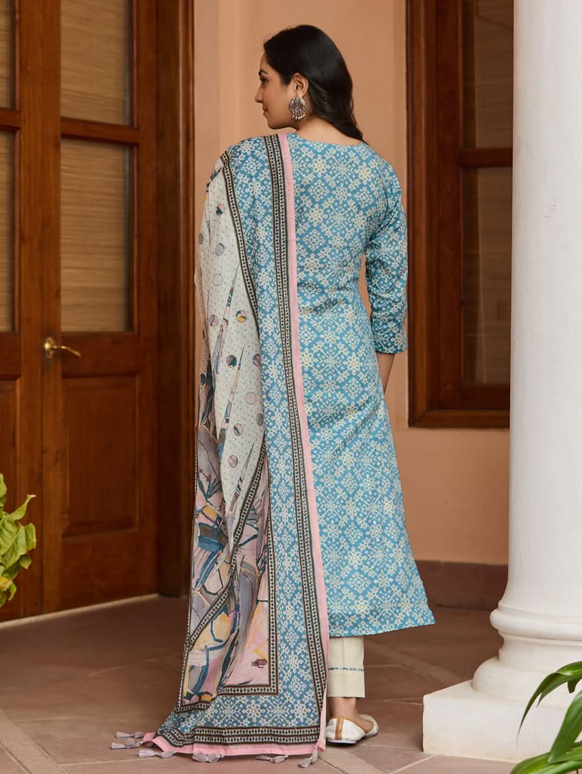 Embroidered cotton suit set, blue kurta with pink trim, cream pants, dupatta draped