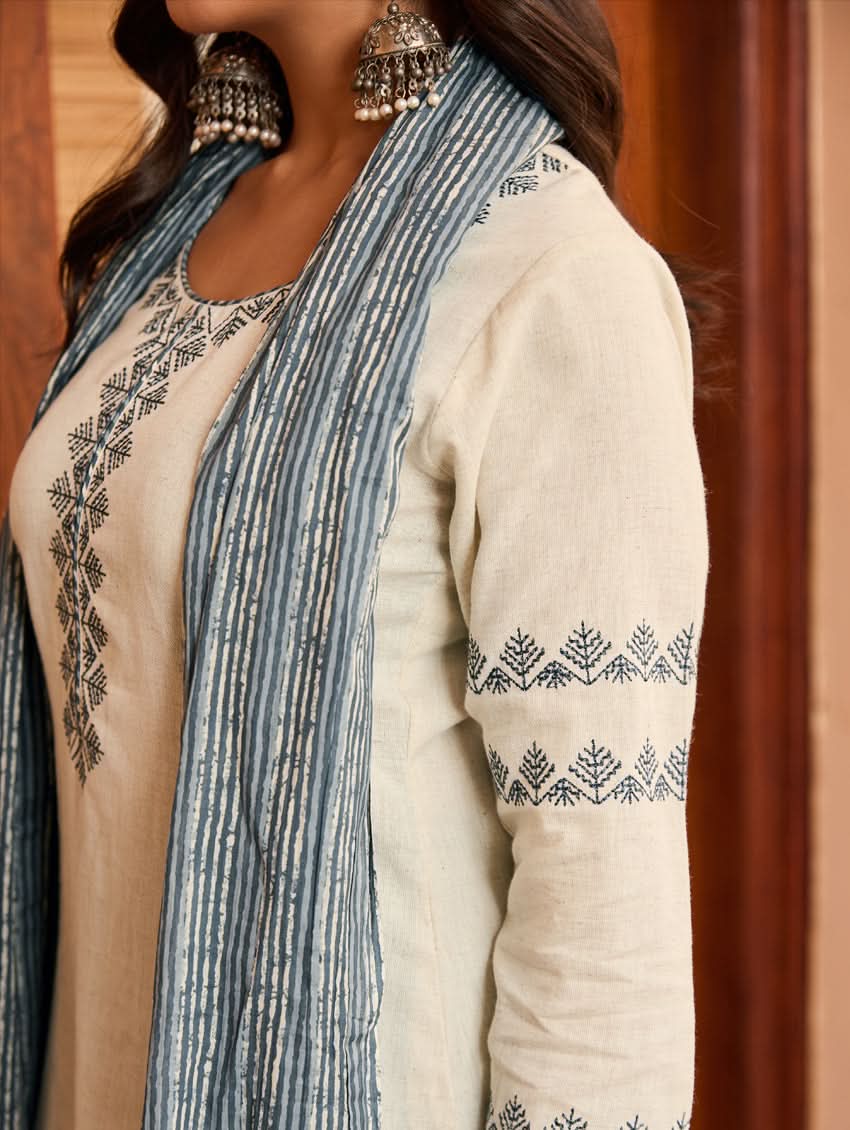 Cream tunic with blue vertical stripes and floral embroidery, paired with striped dupatta