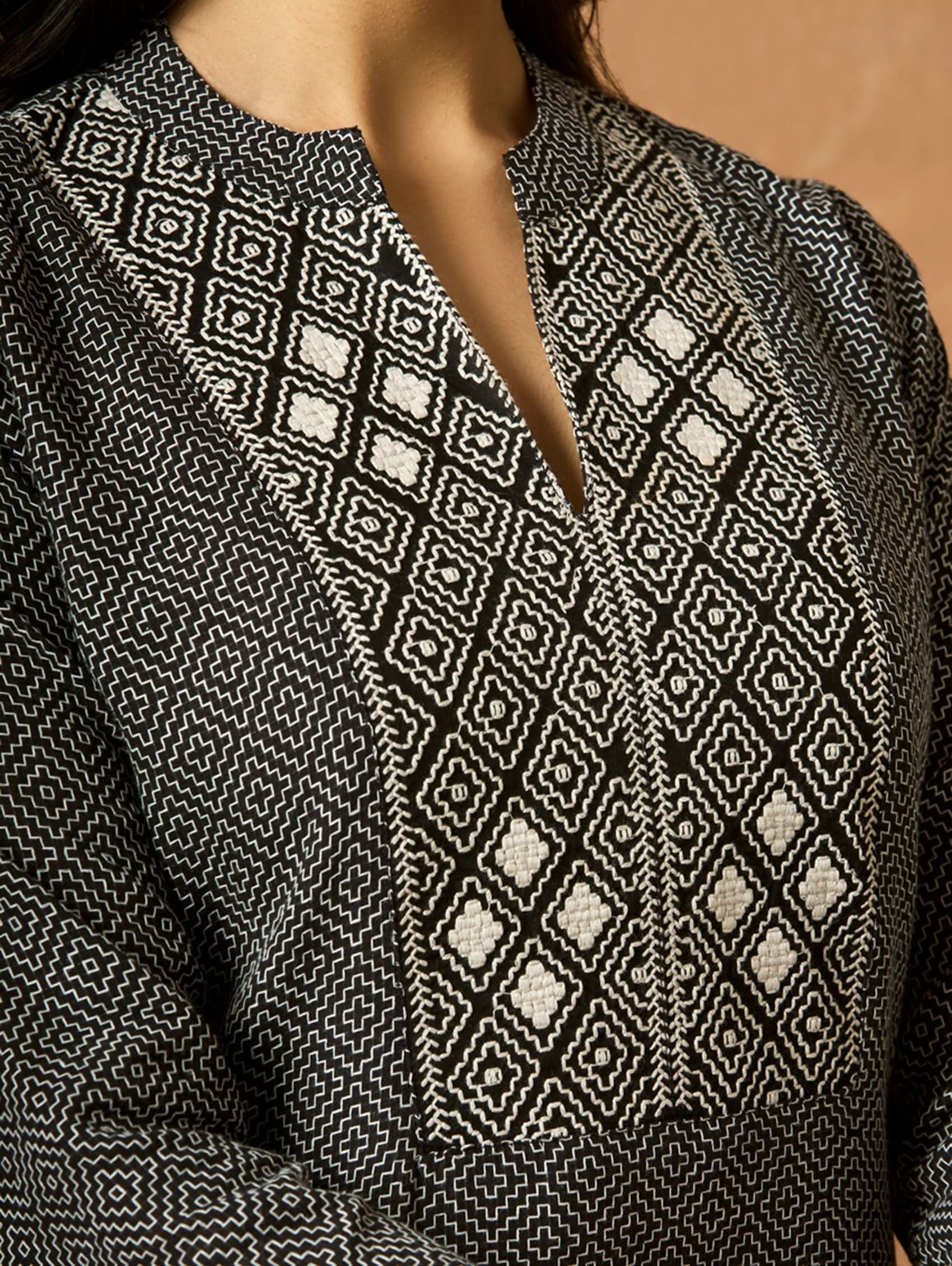 Embroidered cotton kurta close-up of geometric front panel and V-neck detail