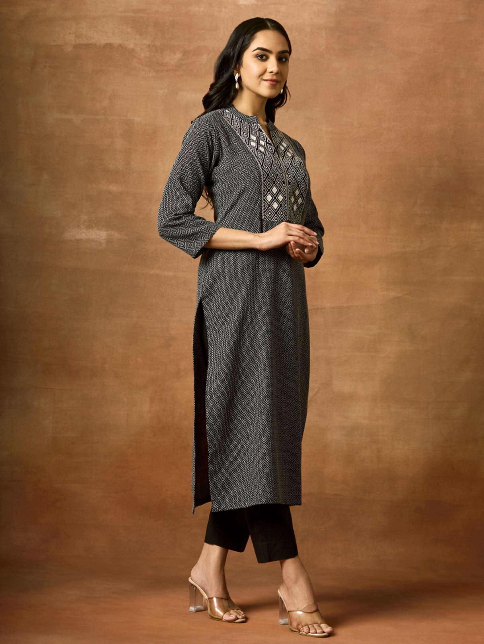 Embroidered cotton kurta with side slit hem and geometric front yoke in dark charcoal