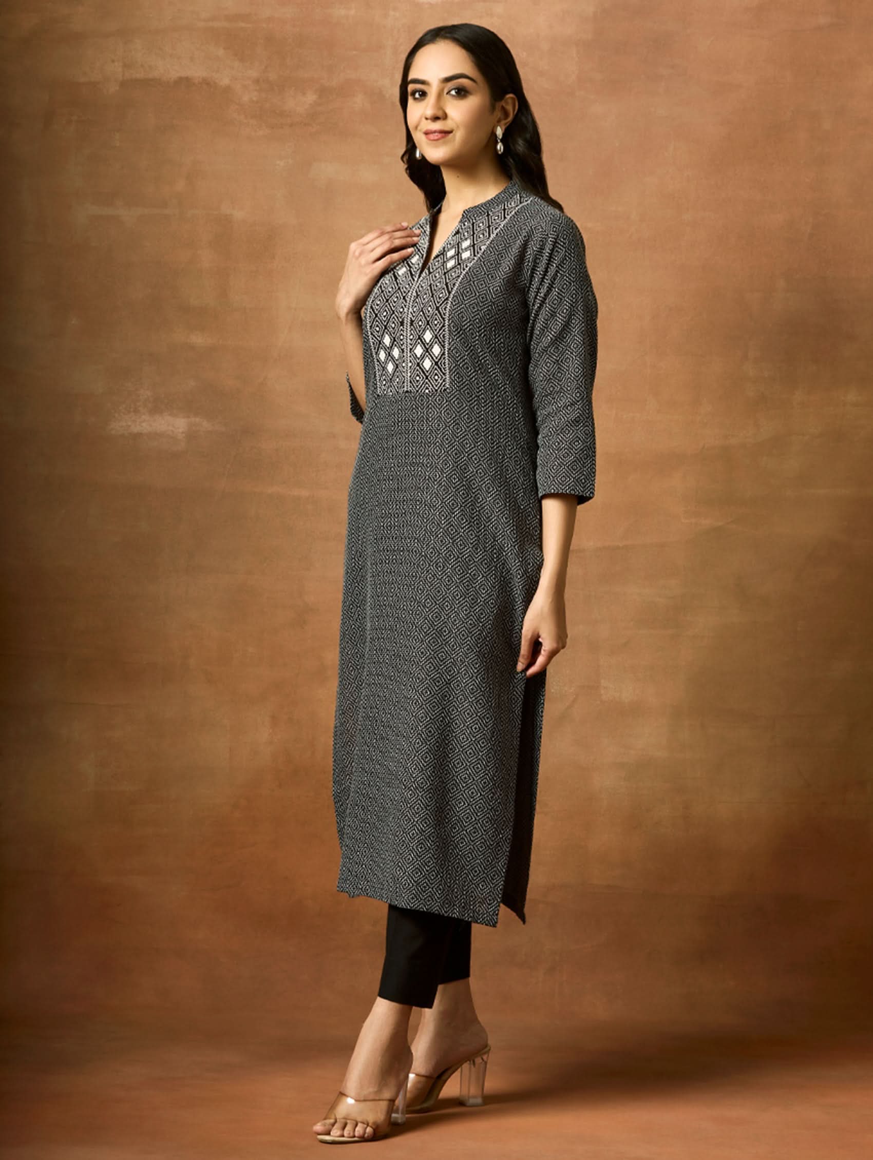 Embroidered cotton kurta side view with geometric yoke and three-quarter sleeves
