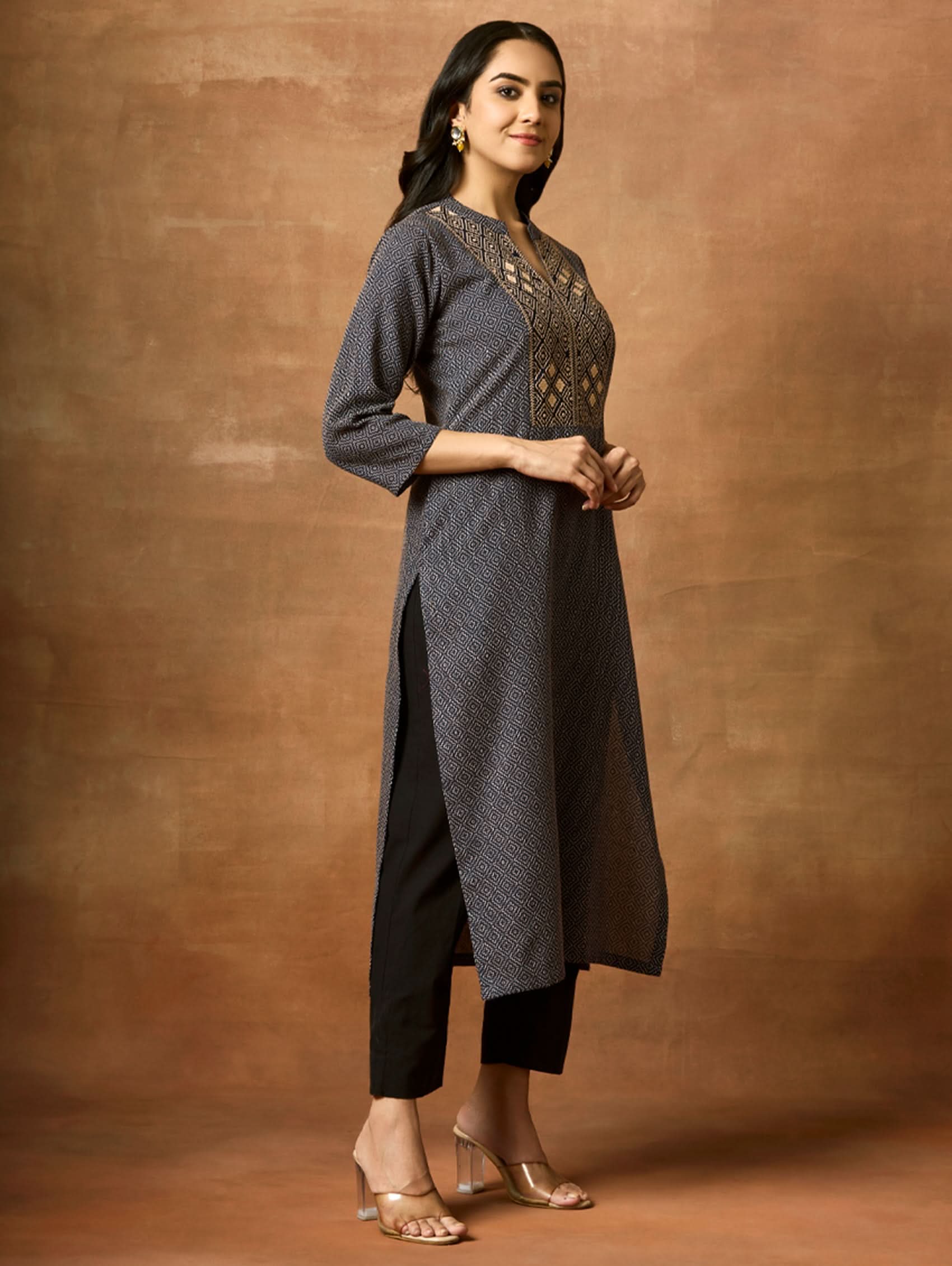Embroidered cotton kurta front view with geometric yoke and dark straight hem