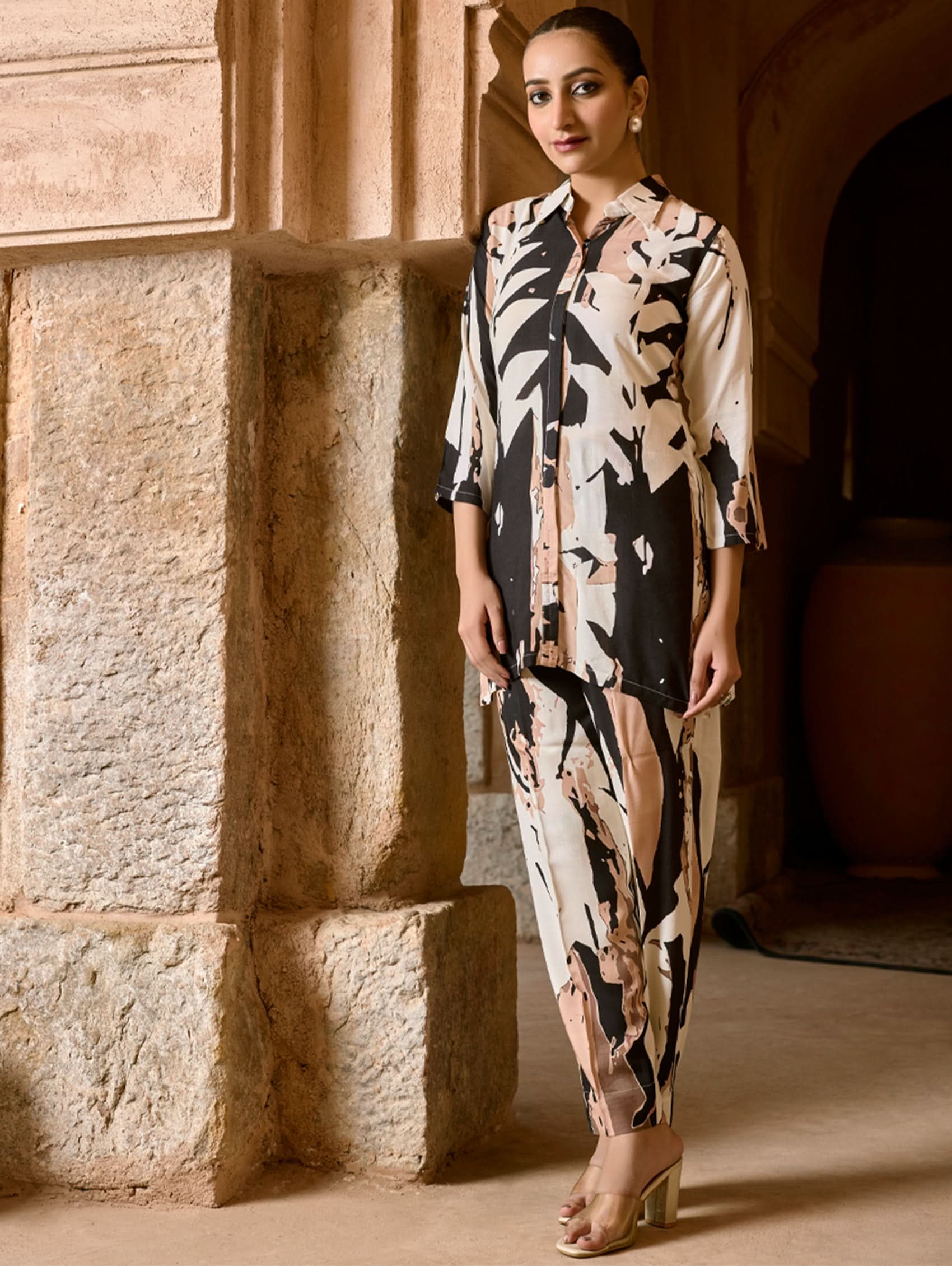 Women wearing a printed Co ord set with shirt collar neck style with ankle length pant