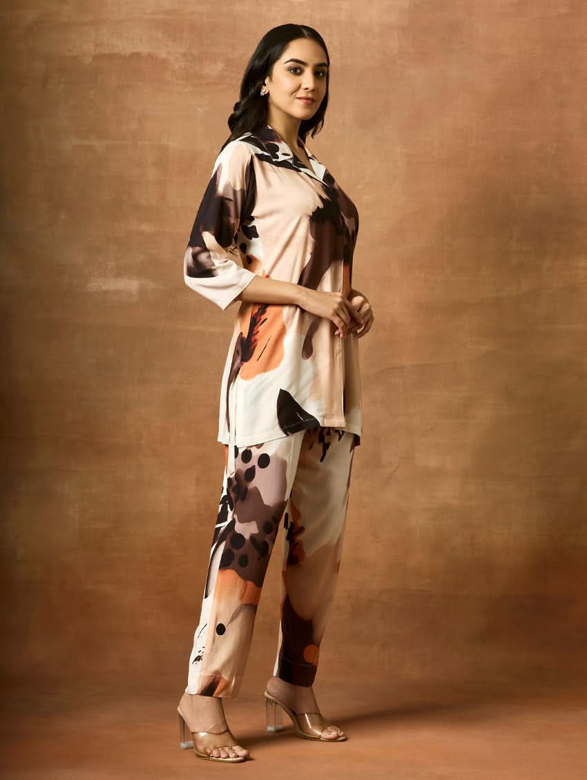 Woman wearing a floral outfit against a brown background