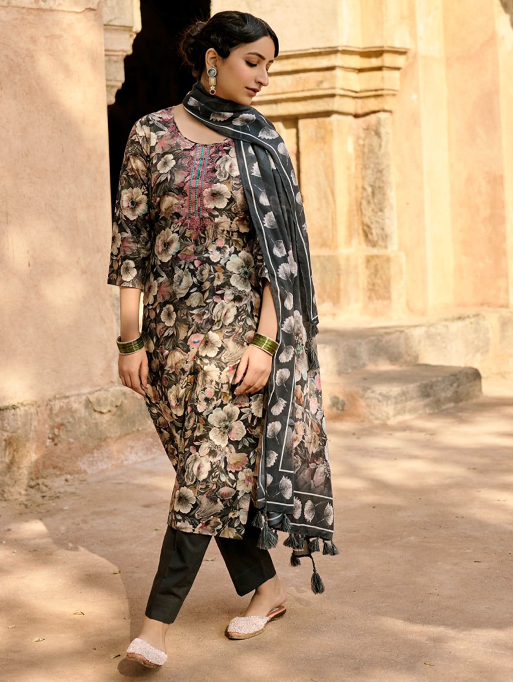 Embroidered floral kurta with black leggings and sheer dupatta, side view