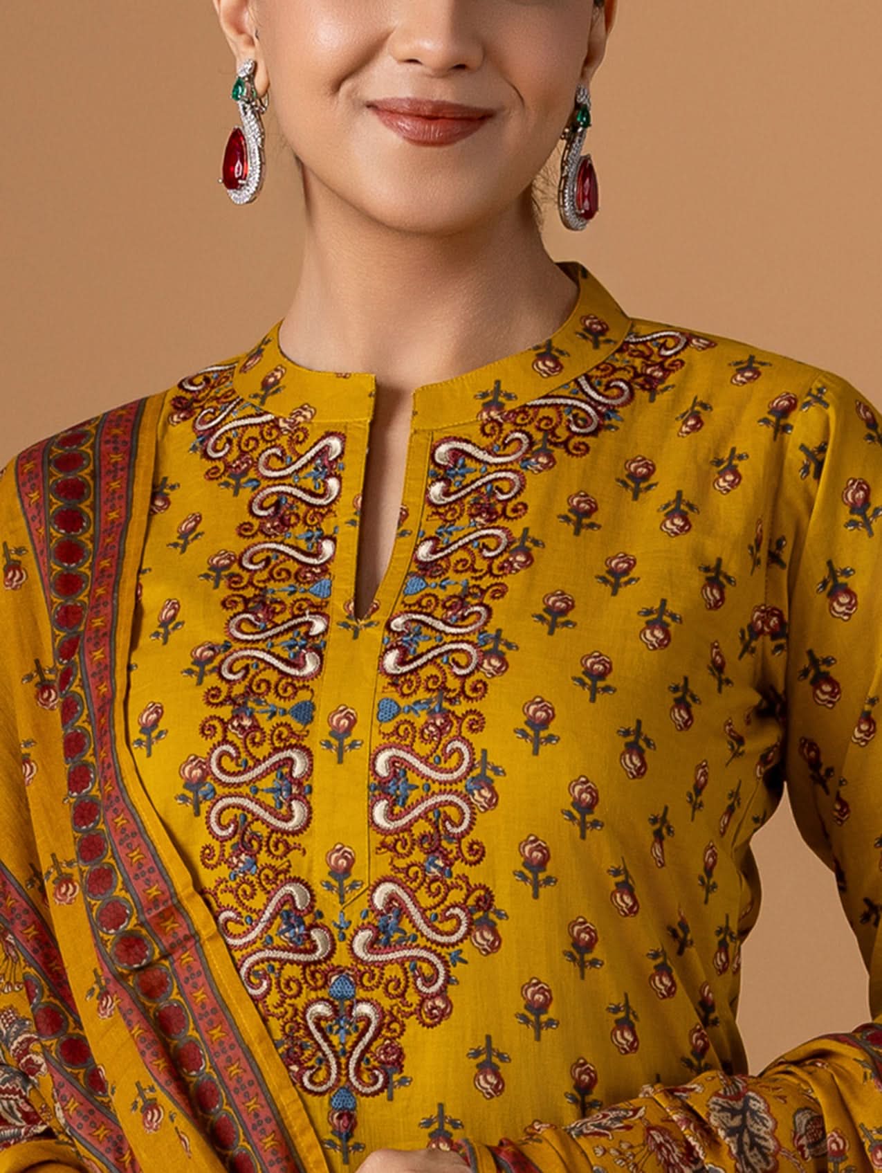 Embroidered yellow kurta with V-style placket, multicolor motifs, and round neckline