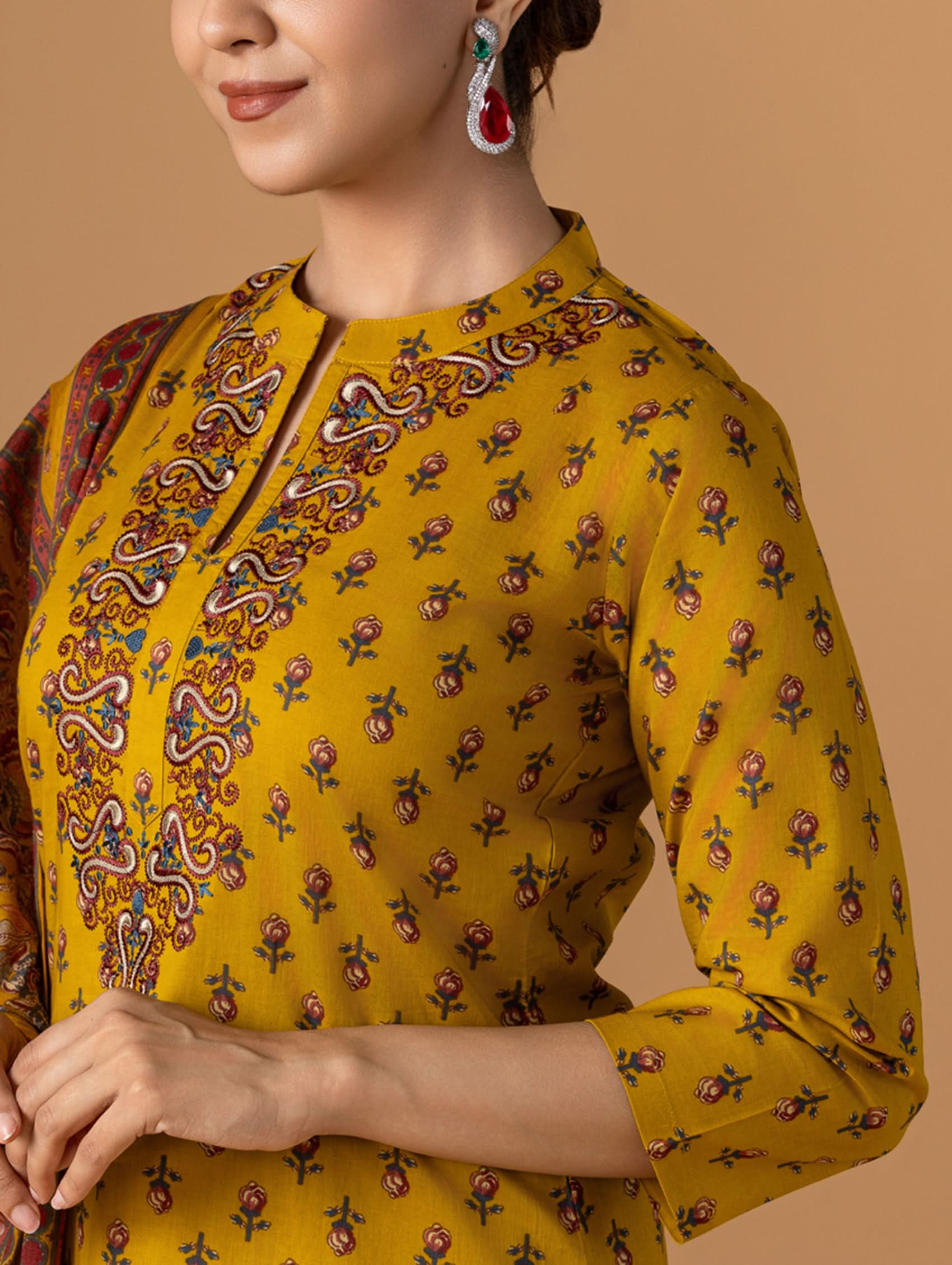 Embroidered yellow kurta with 3/4 sleeves and multicolor motif detailing