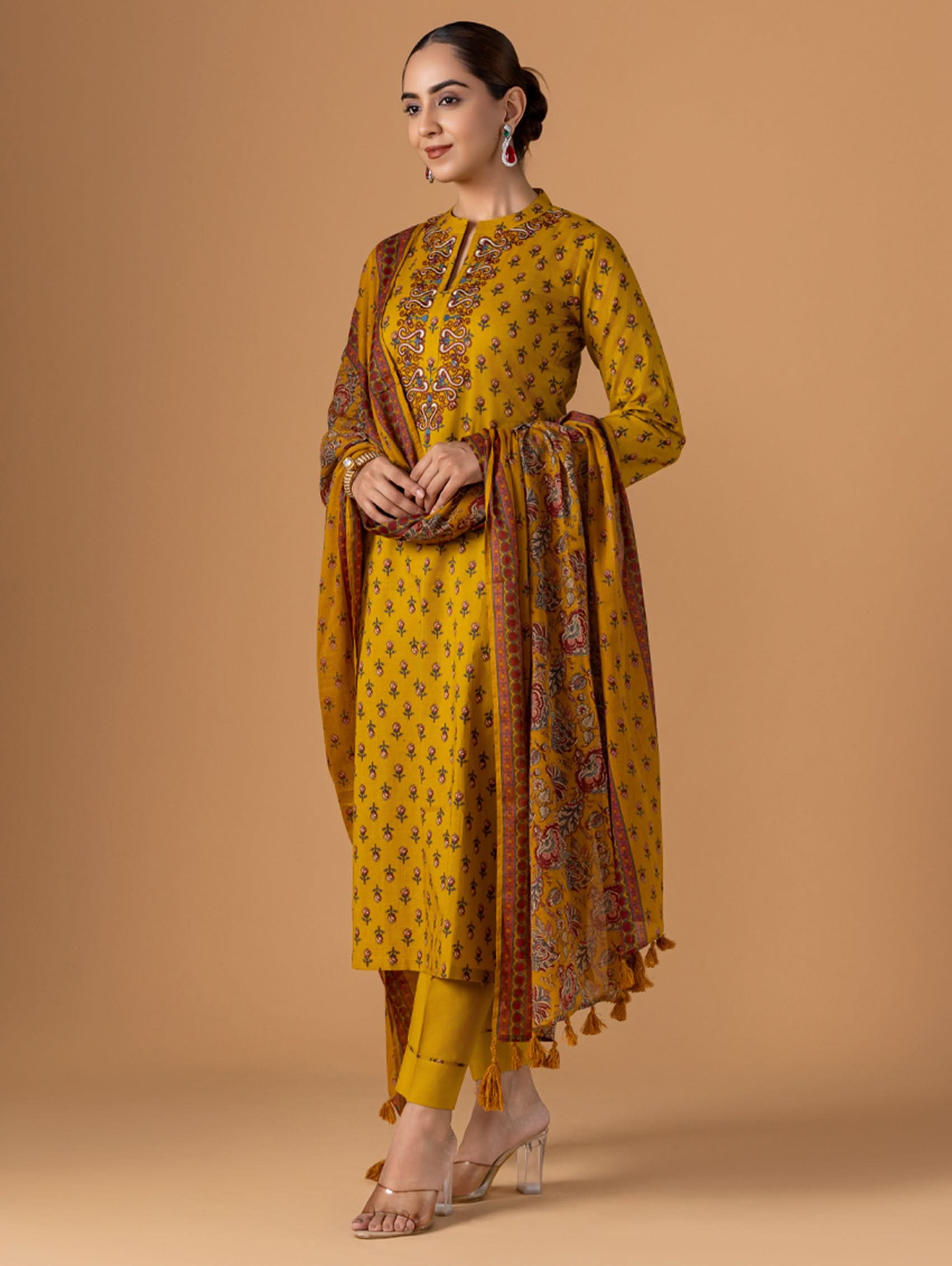 Embroidered yellow cotton suit set with long kurta, pants, and bordered dupatta