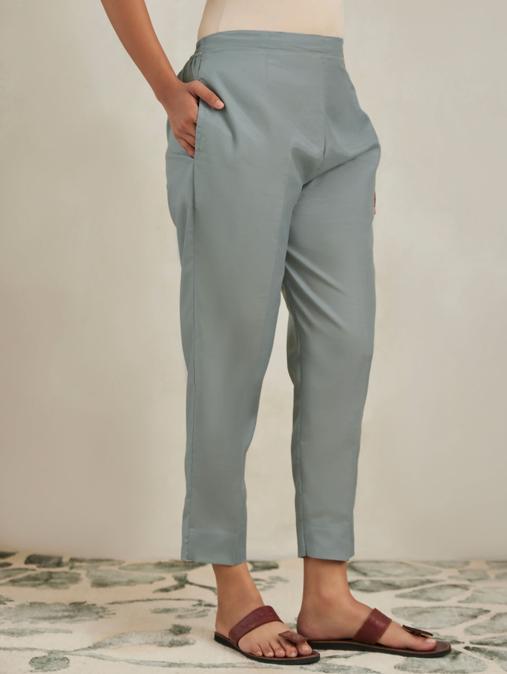 Light blue pants worn by a person on a neutral background