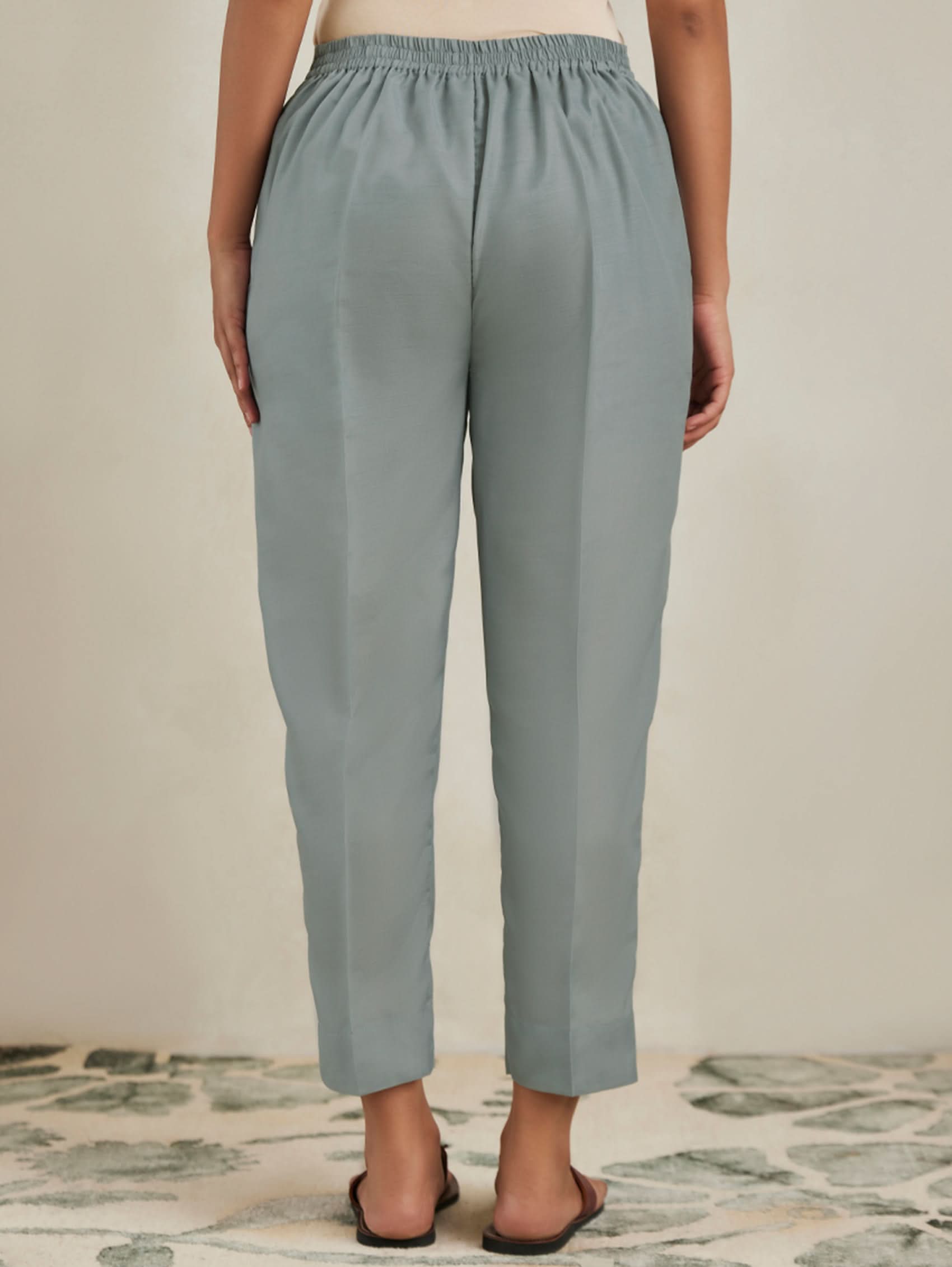 Light blue pants worn by a person on a neutral background