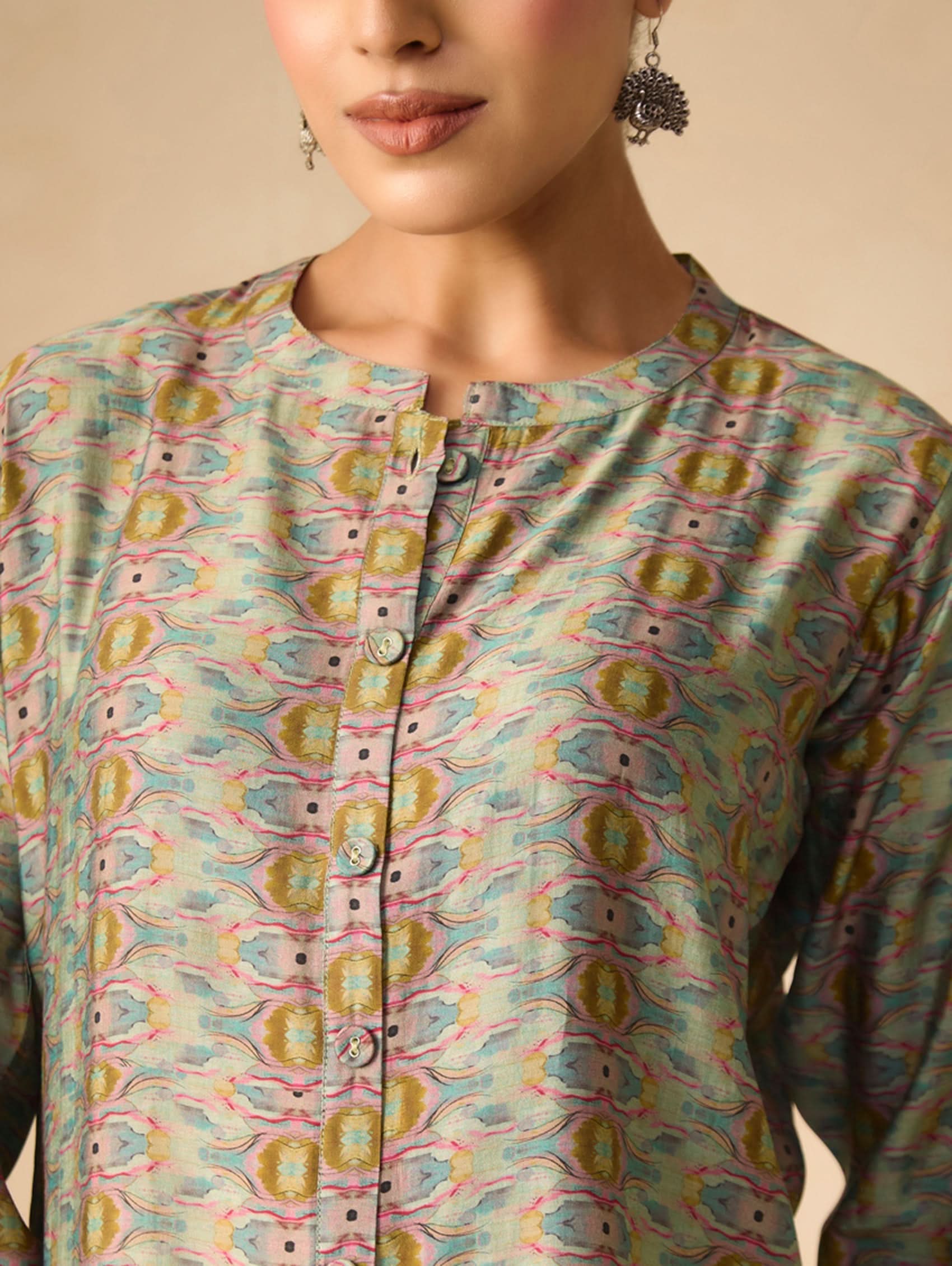 Patterned shirt worn by a person on a beige background