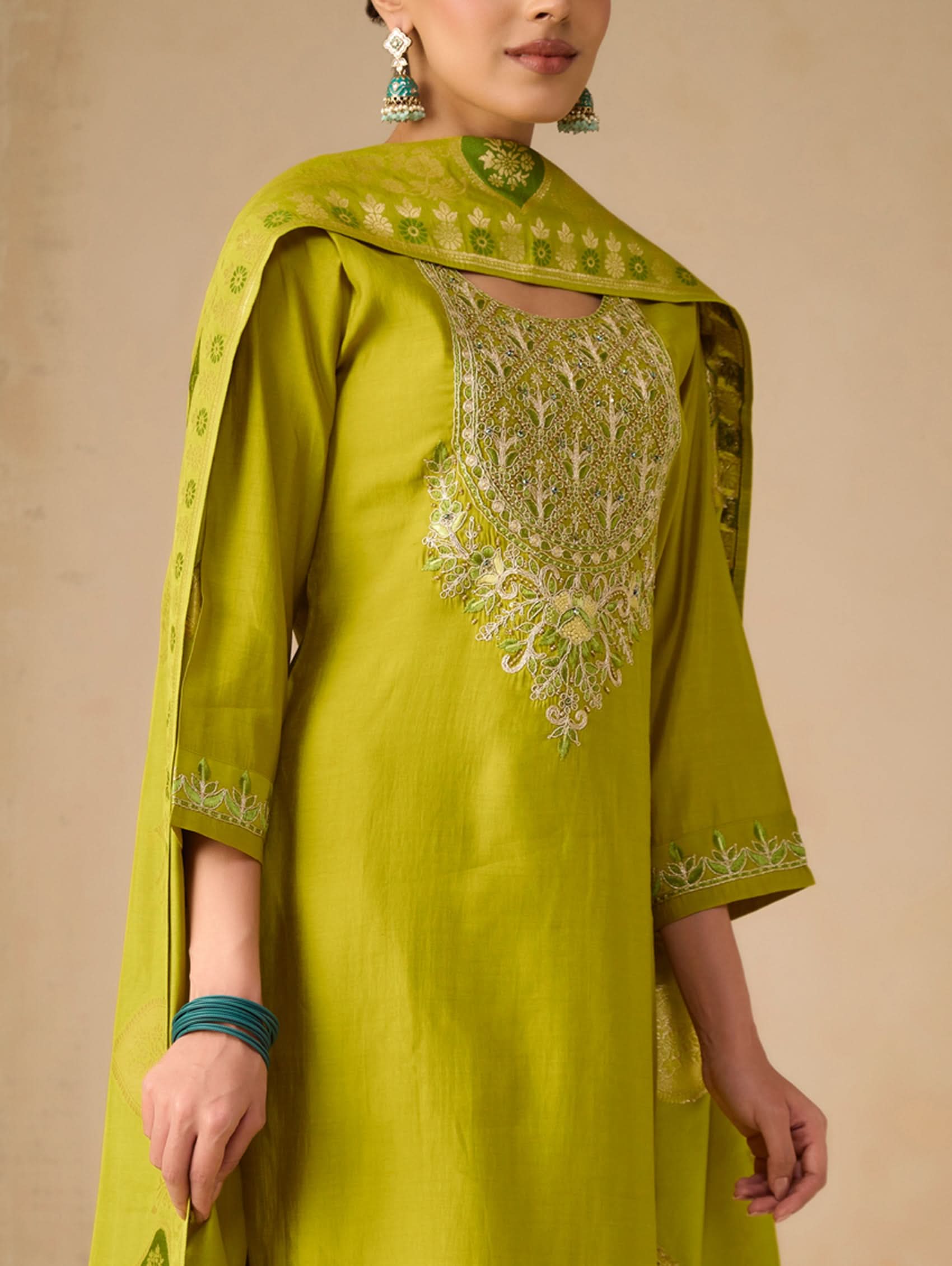 Embroidered lime-green tunic with gold neckline border and front motif