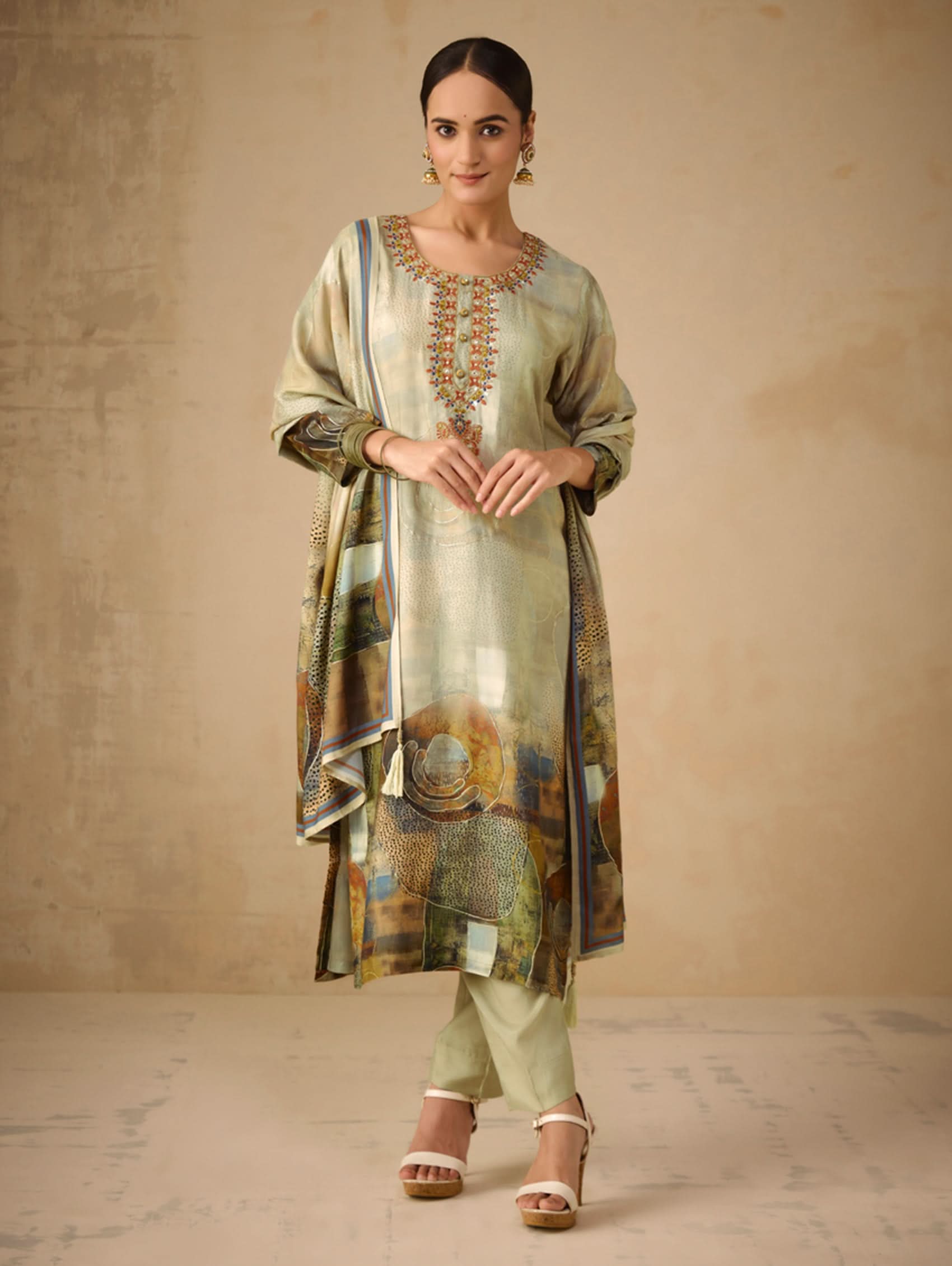 Woman wearing a traditional outfit with a textured background