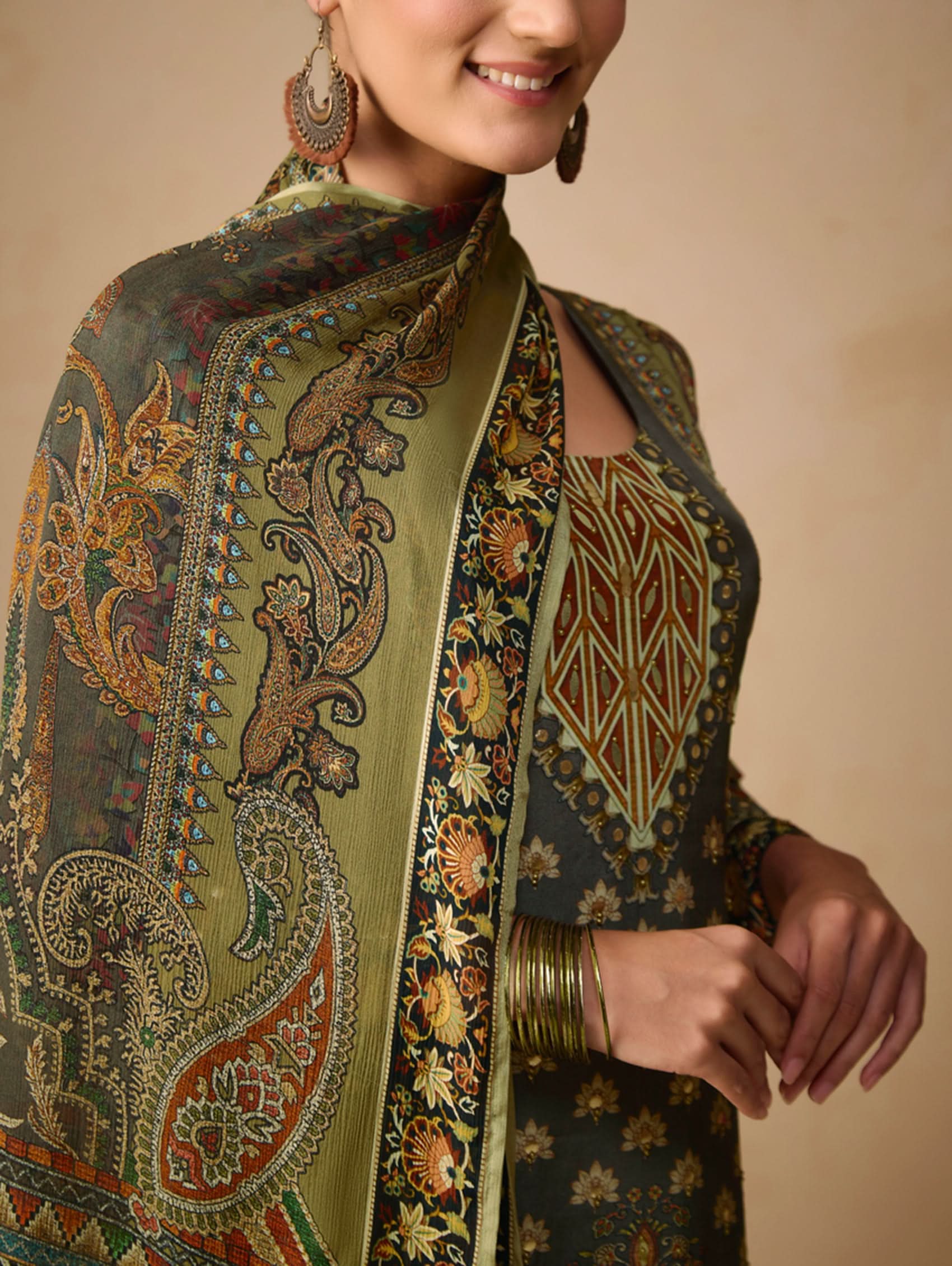 Woman wearing a traditional embroidered outfit with a beige background