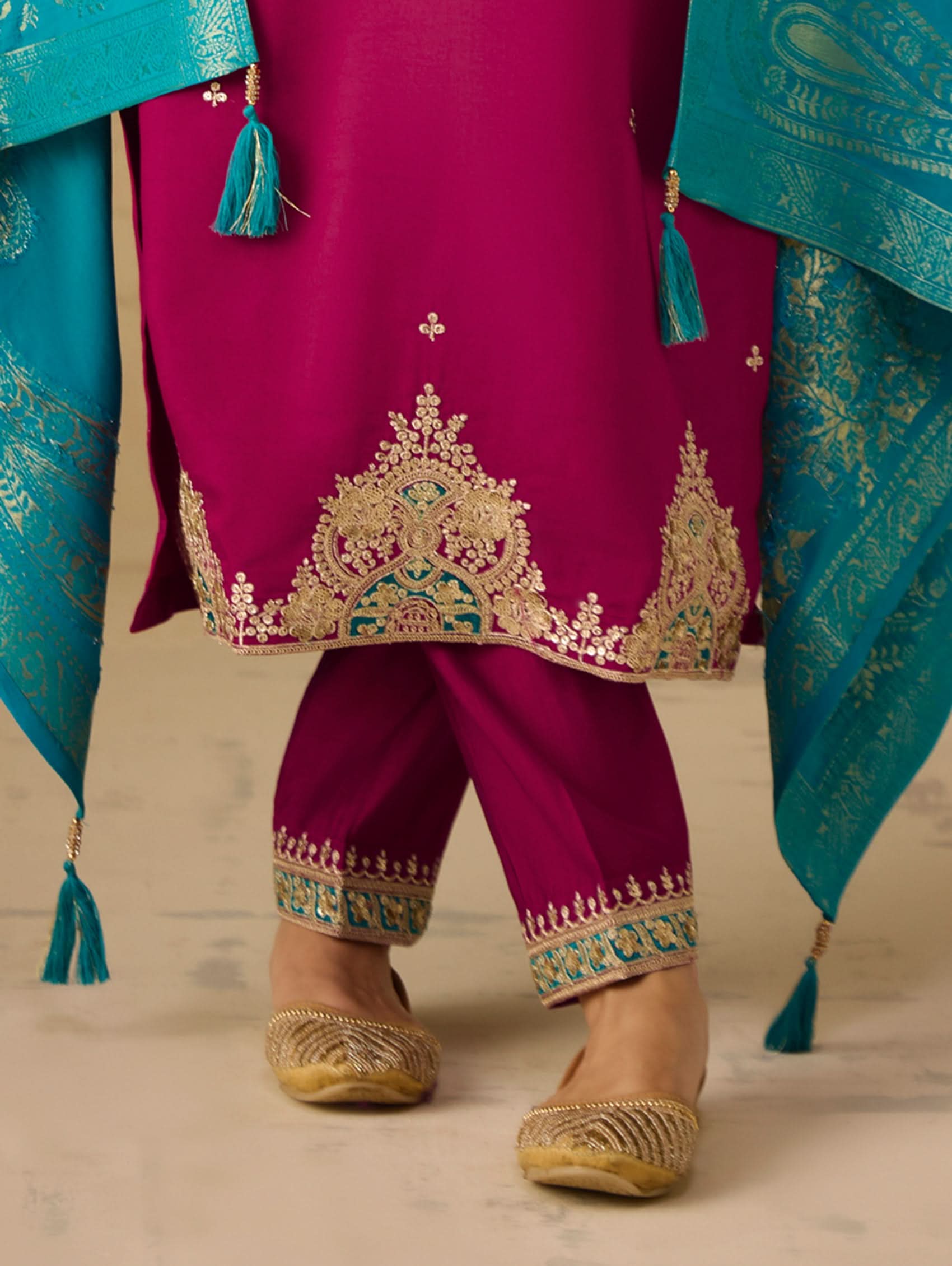 Embroidered berry pants with gold border and teal trims, dupatta tassel edges