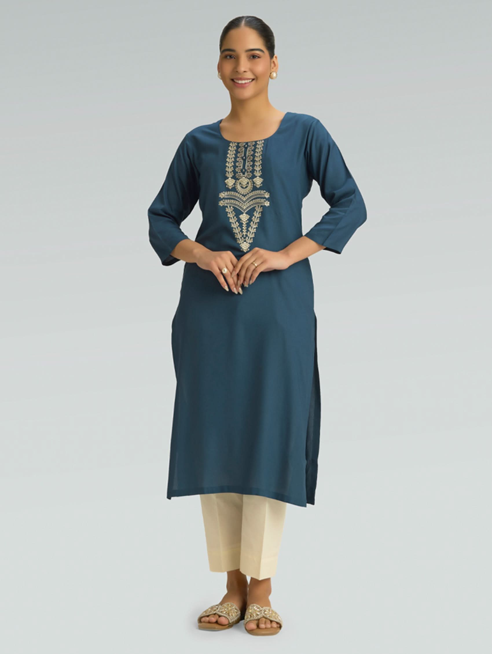 “Straight-fit blue kurta with round collar and computerized thread embroidery on a gray background.”