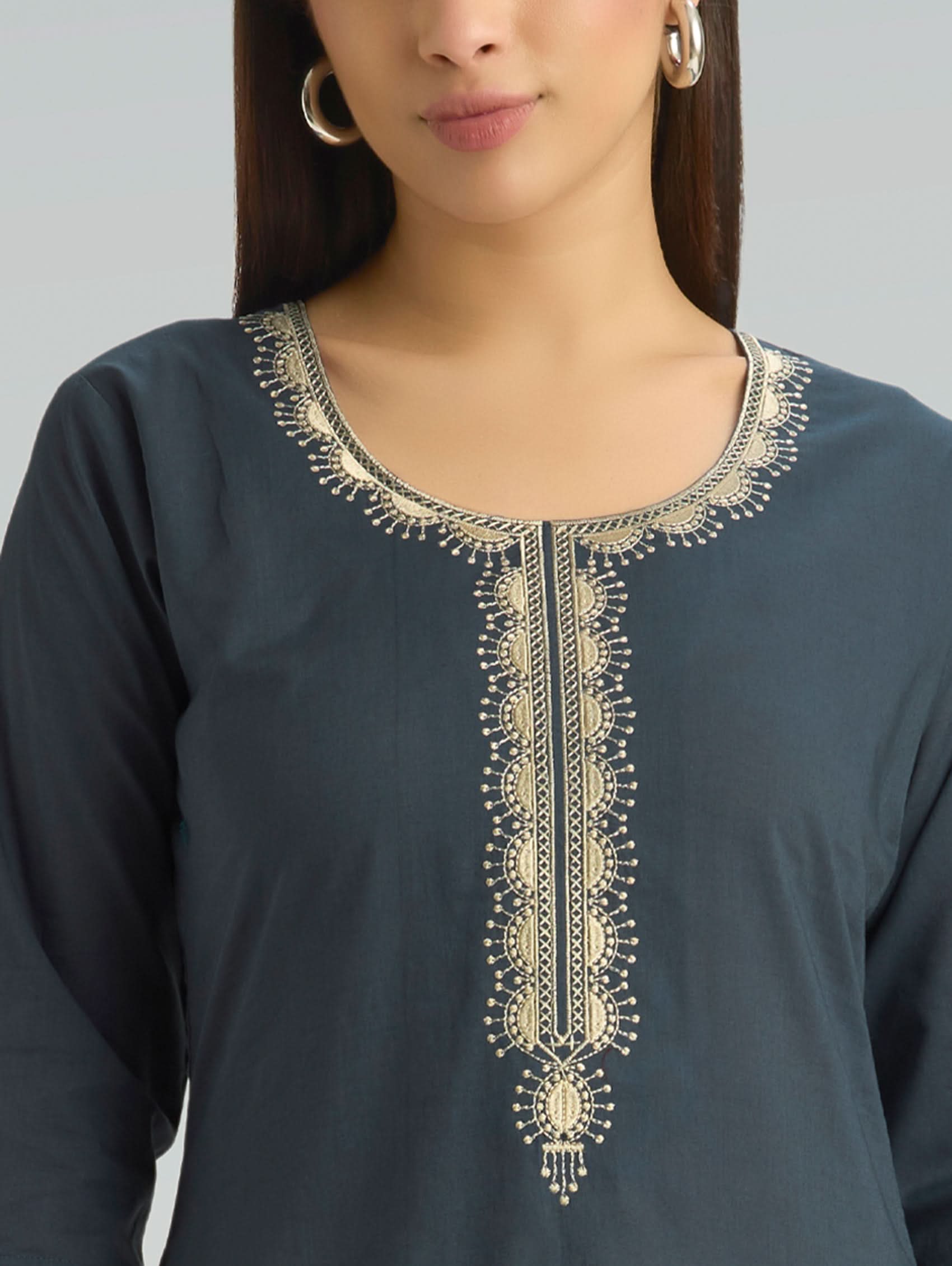 Navy blue kurta with gold embroidery on a plain background