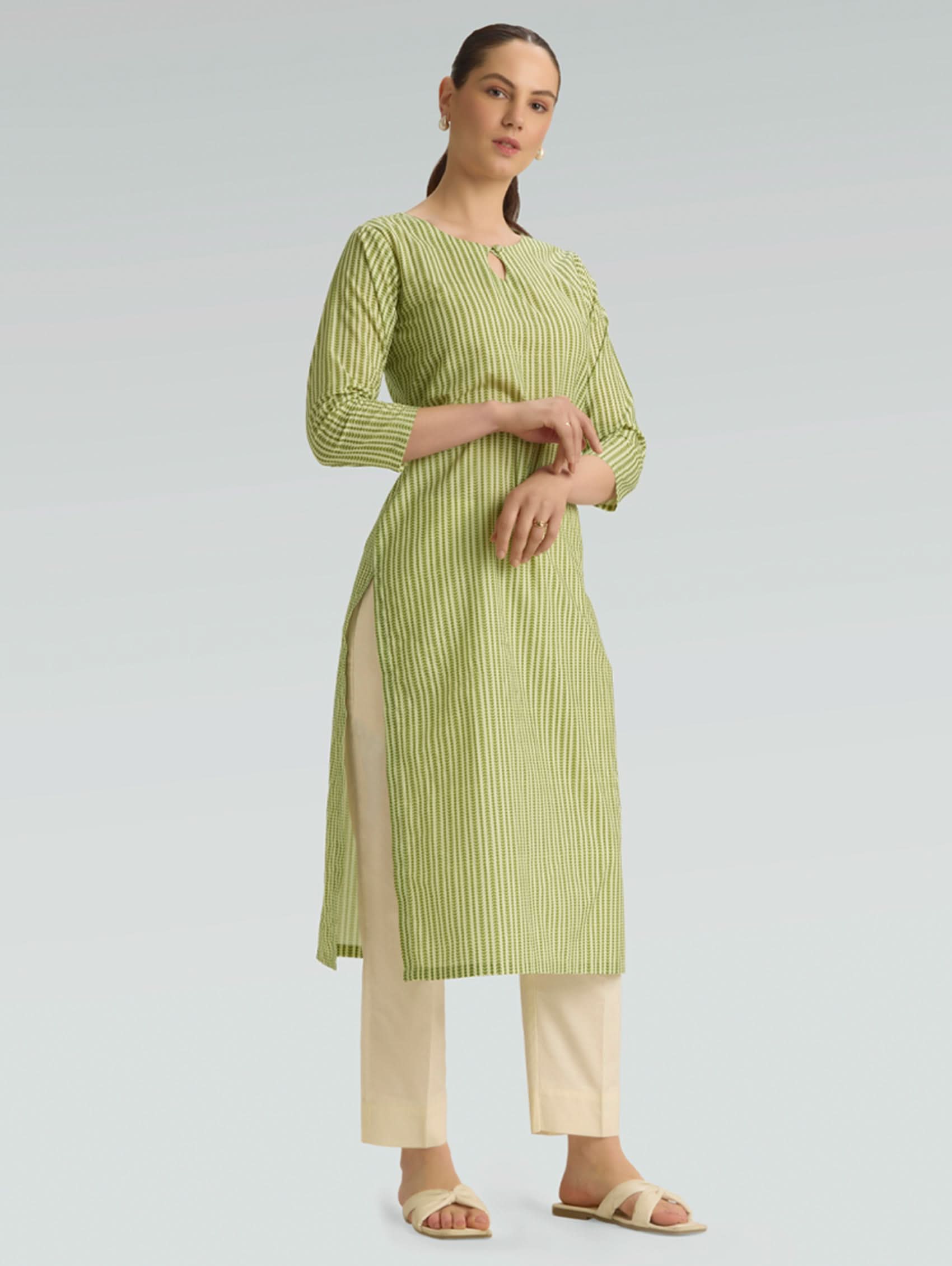 Plus size green leaf print cotton linen kurta for women — side view showing three-quarter sleeves and kurta length