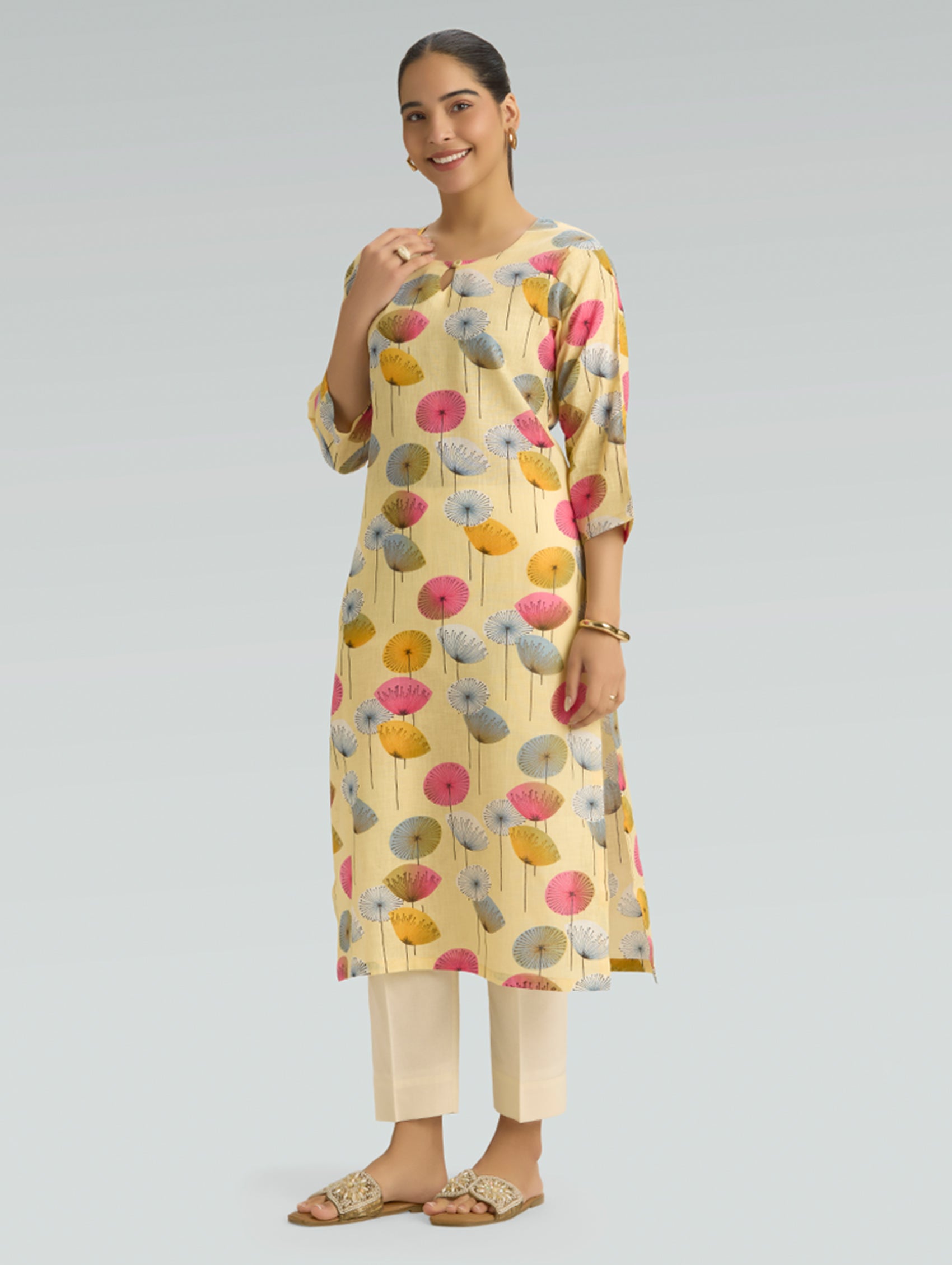 Model wearing pale yellow floral printed cotton linen kurta for women