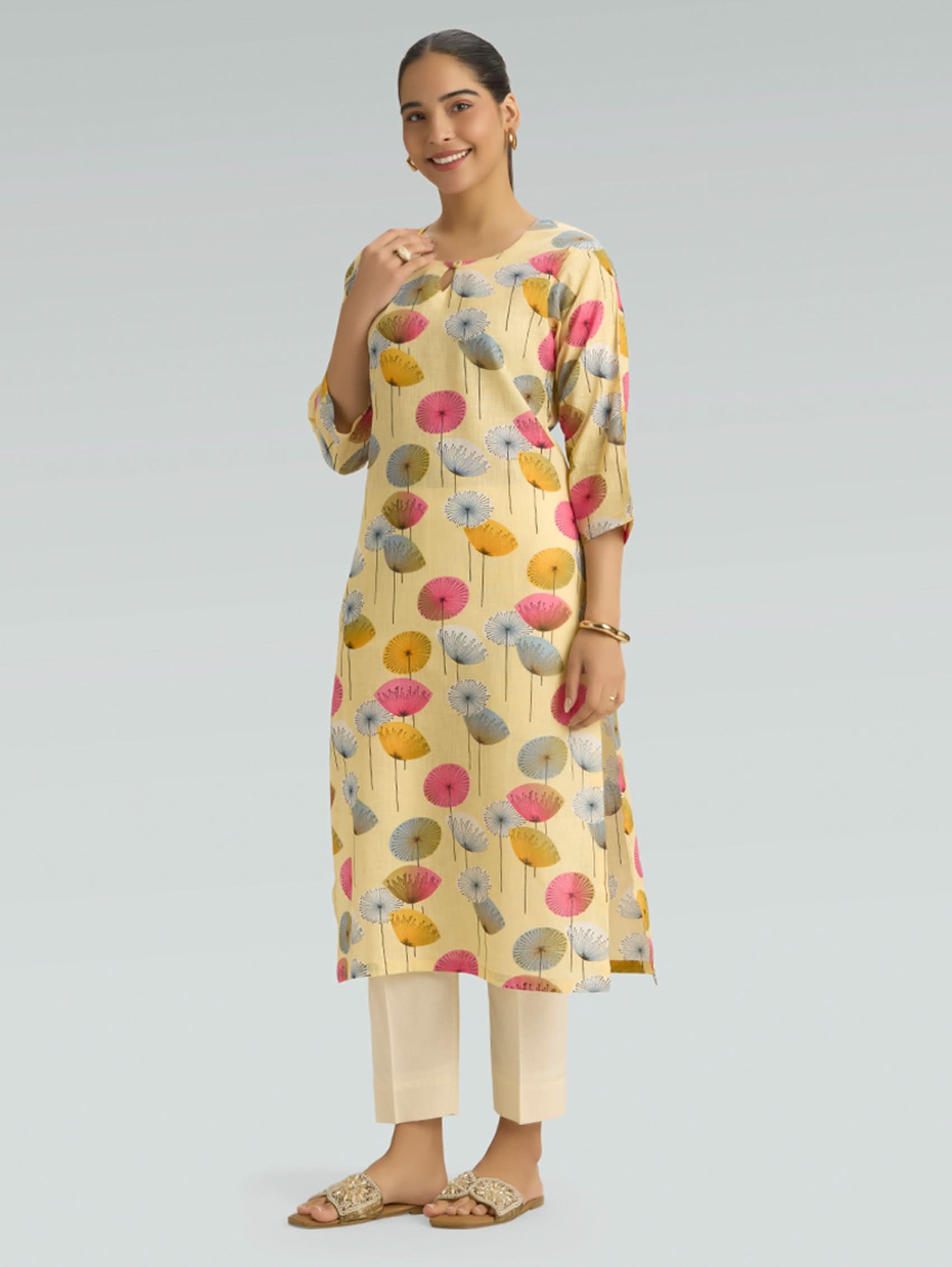 Model wearing pale yellow floral printed cotton linen kurta for women