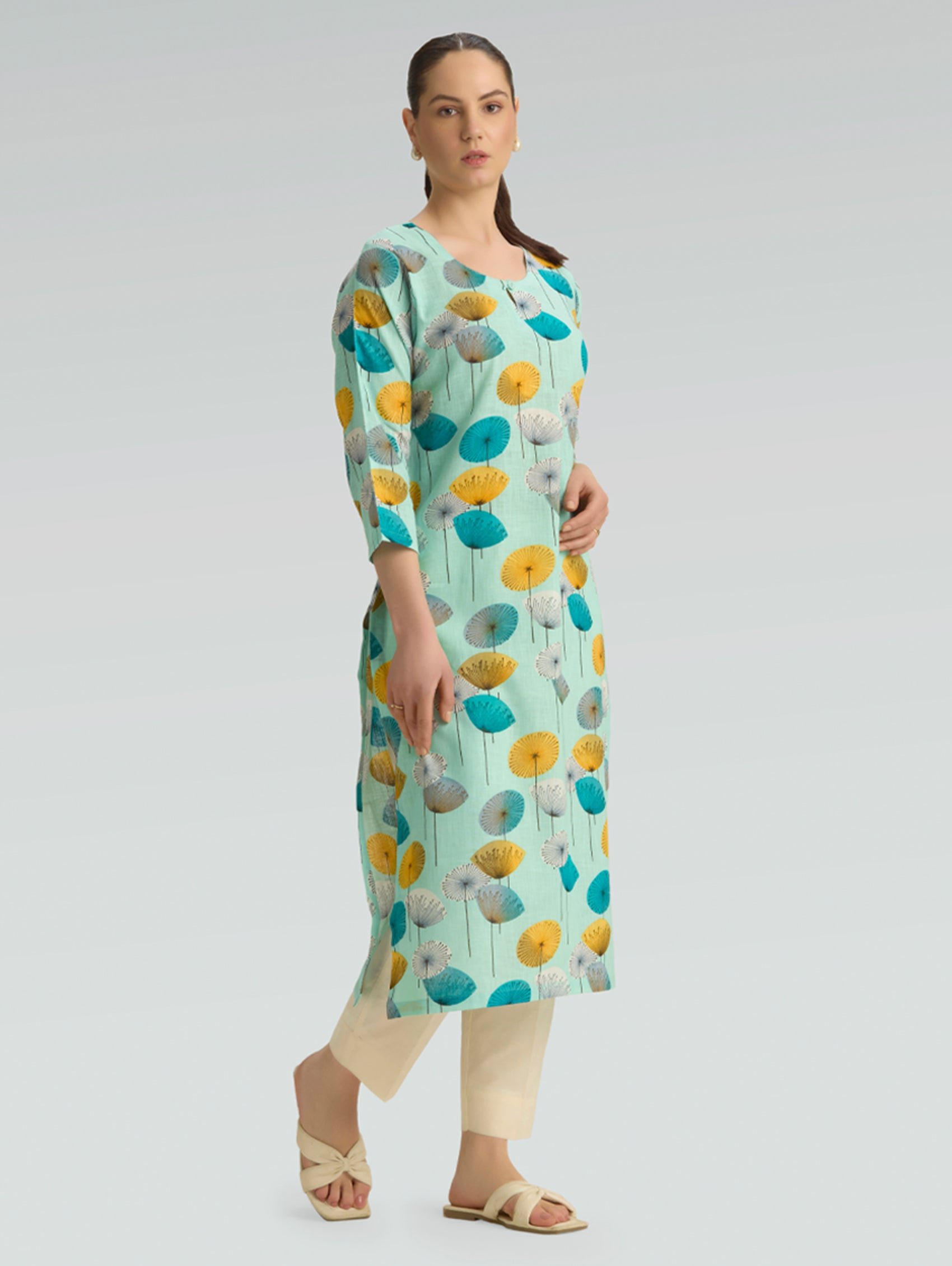 Model wearing mint green floral printed cotton linen kurta styled for casual ethnic wear