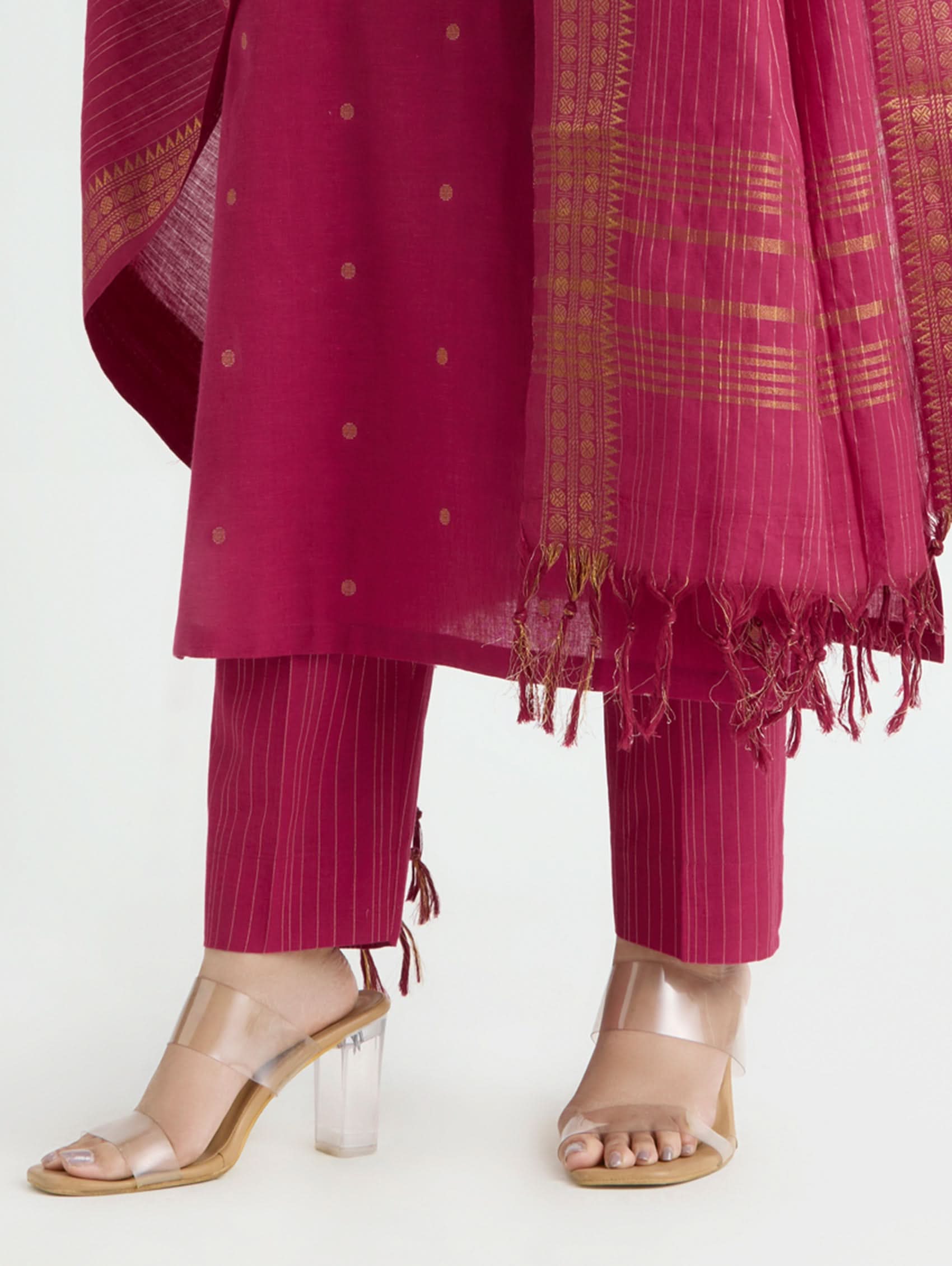 Pink traditional outfit with a matching dupatta on a white background
