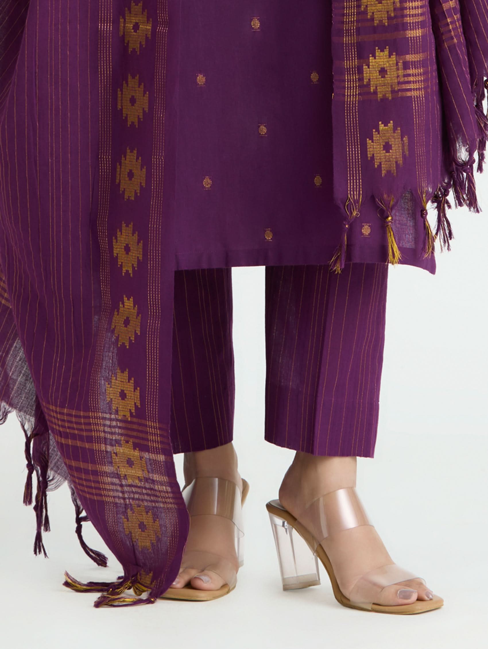 Purple traditional outfit with a matching dupatta on a white background