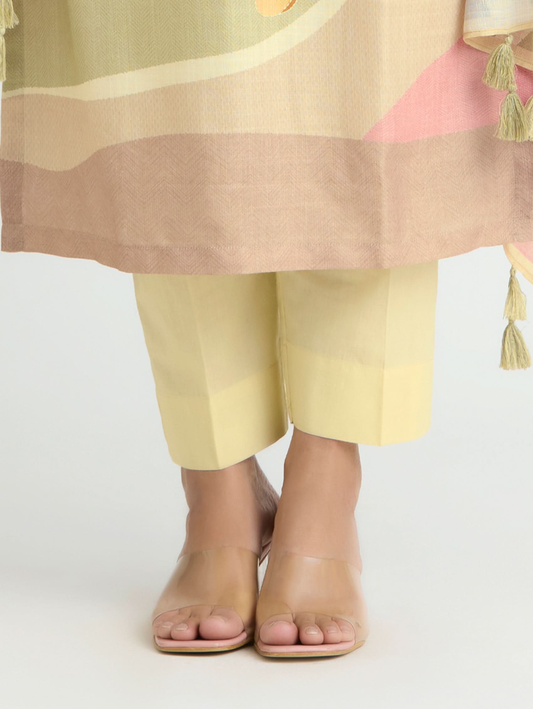 Person wearing a colorful outfit with a light-colored background