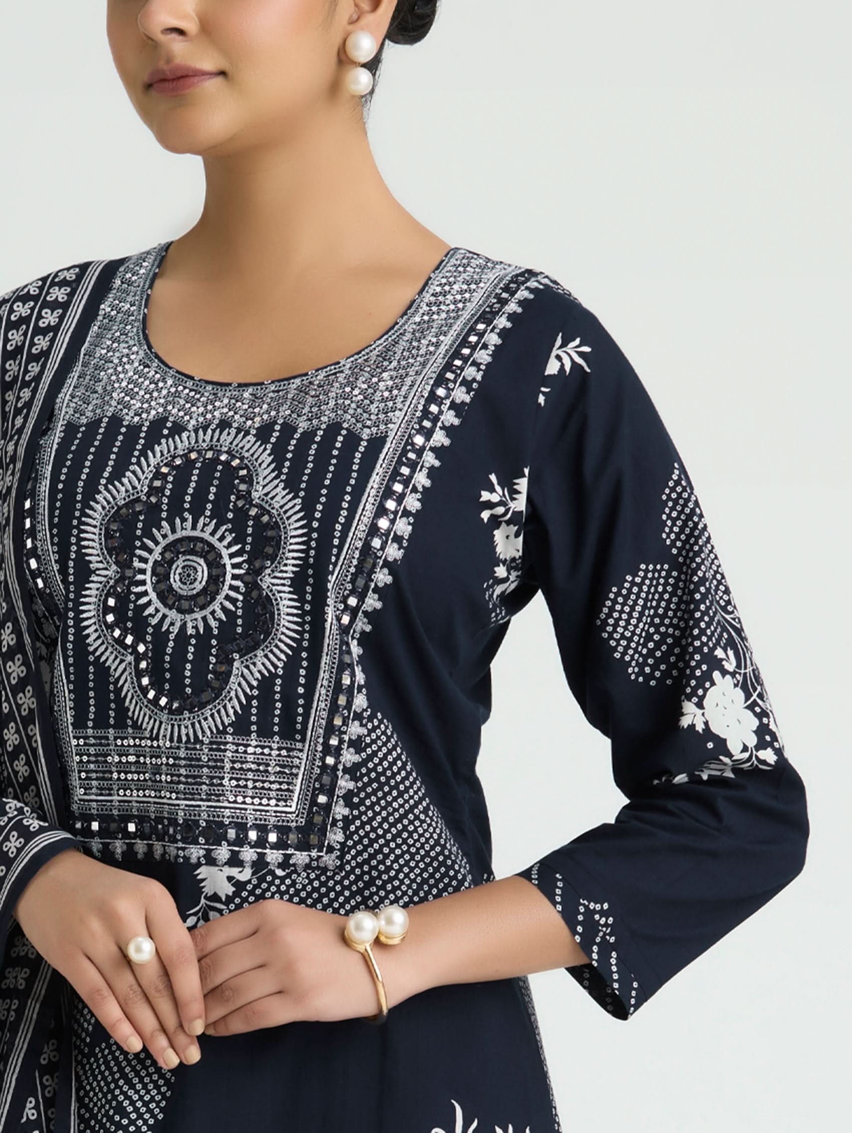 Dark navy blue embroidered cotton kurta front with round neckline and ornate central motif