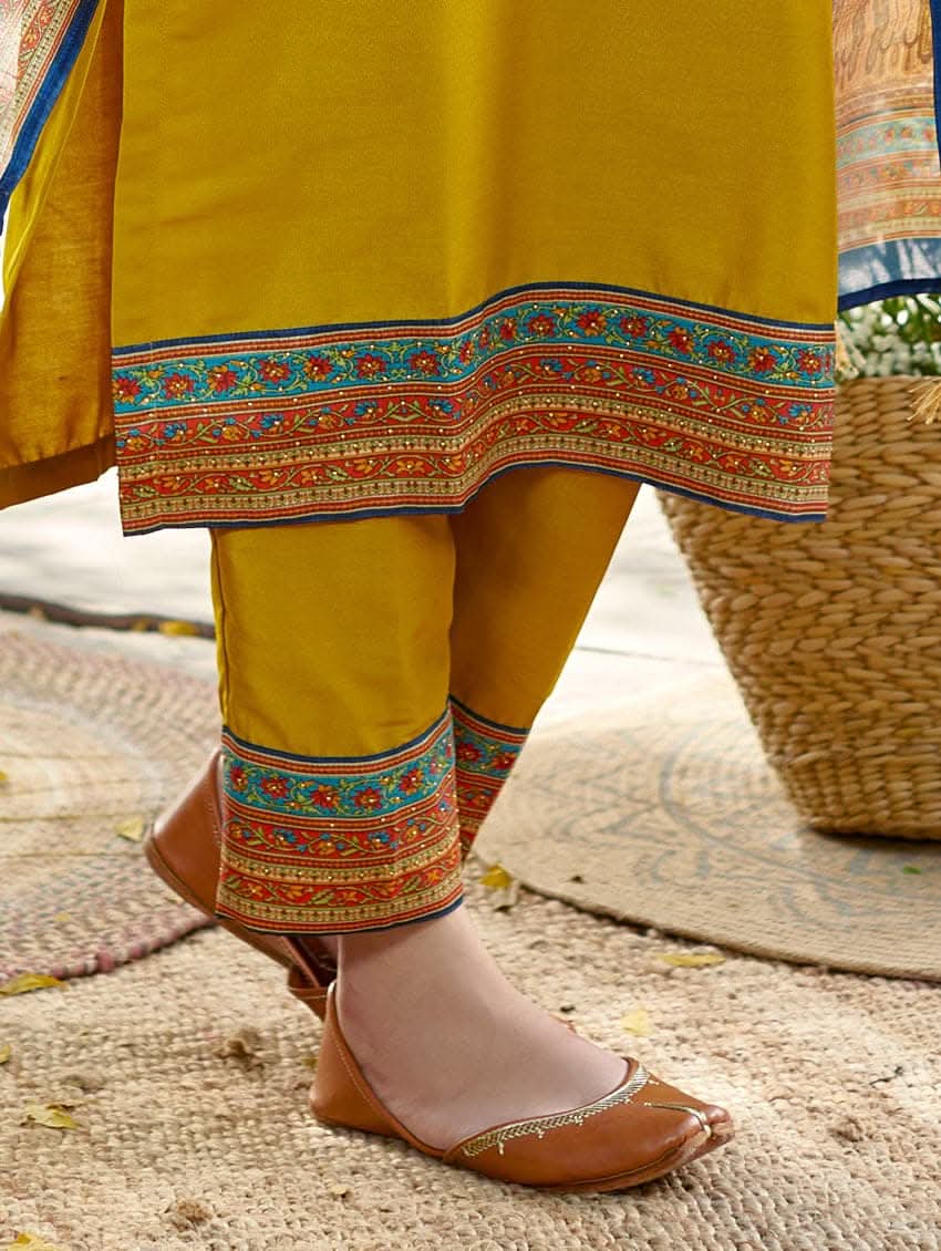 Yellow rayon pants with blue, orange and green border at hem and ankles