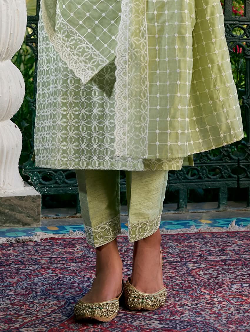 Light green embroidered pants with matching tunic hem and gold-toned trim