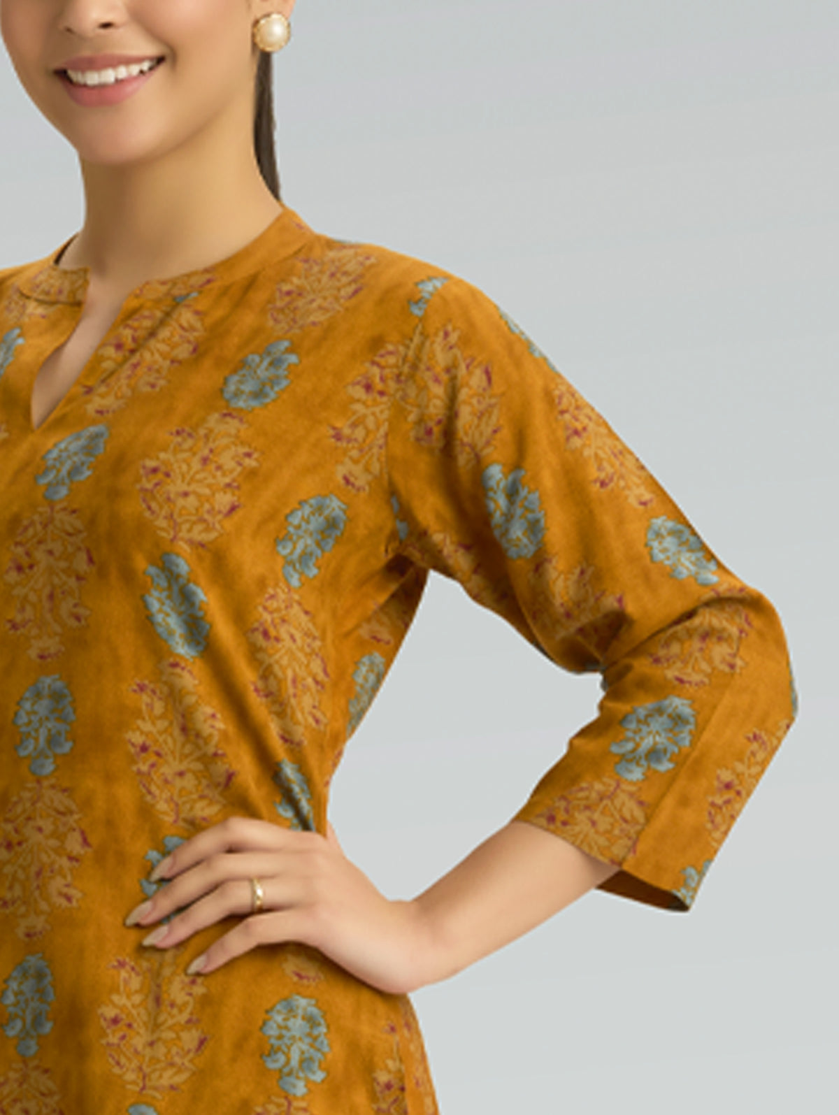 Mustard kurta with blue floral prints, V-neck, and 3/4 sleeve cuff detail