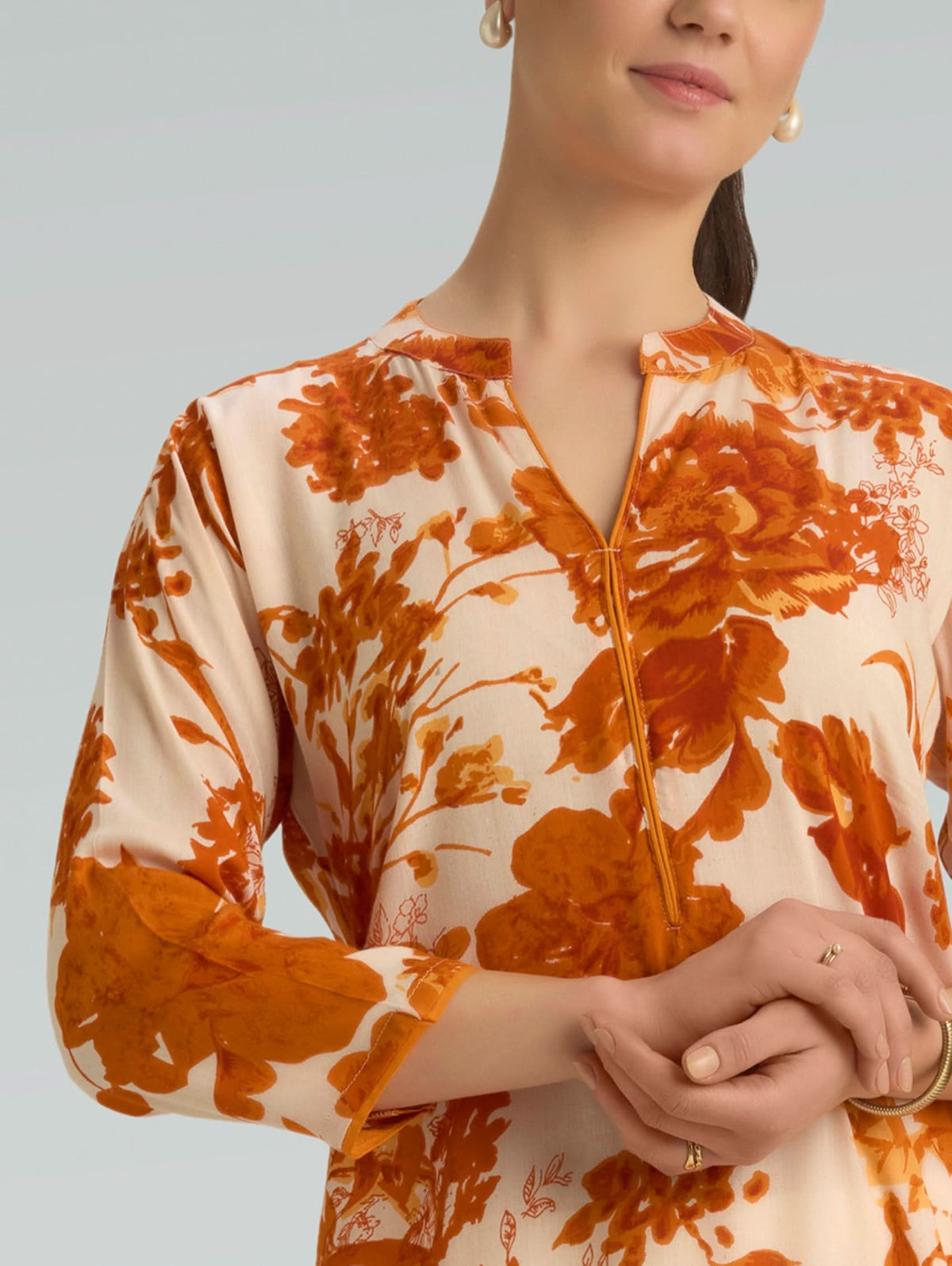 Cream viscose kurta with orange floral print, V-neck and button placket detail