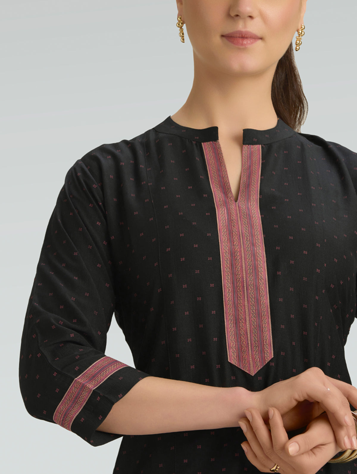 Black printed kurta neckline with vertical pink trim and 3/4 sleeves