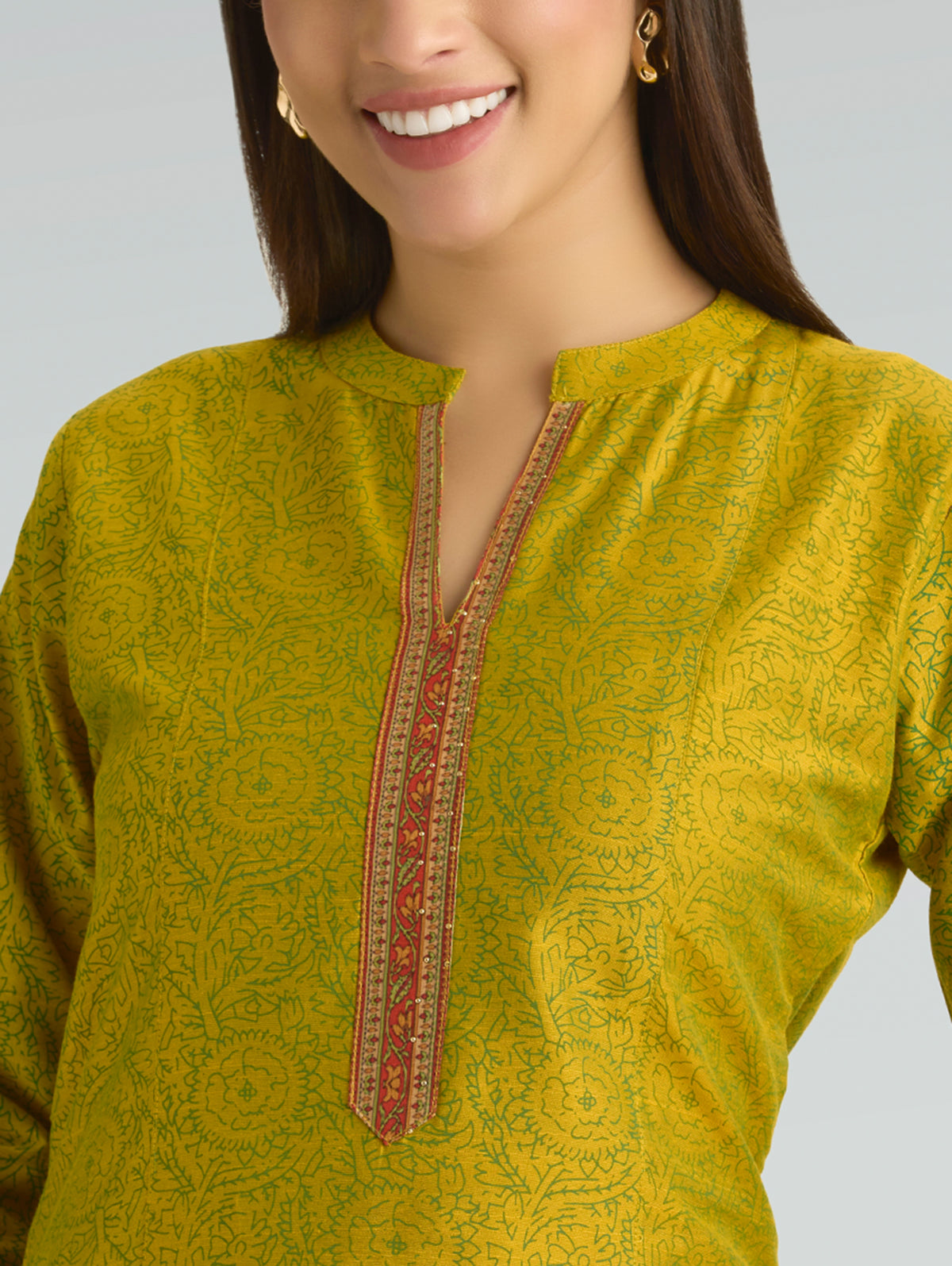 Mustard green printed kurta close-up with V-neck placket and colorful trim
