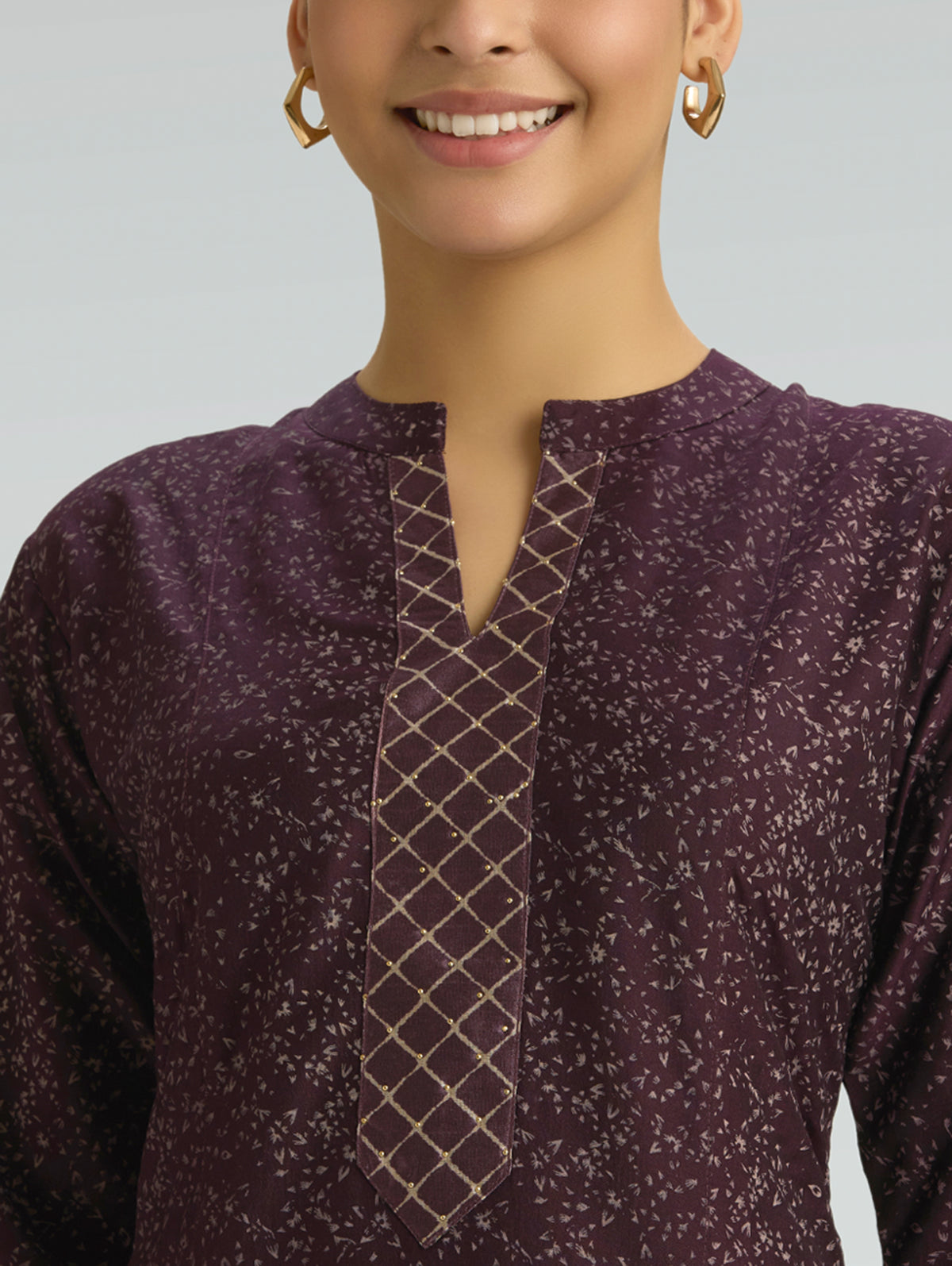 Wine berry kurta neckline with keyhole slit and grid-trim placket, close-up