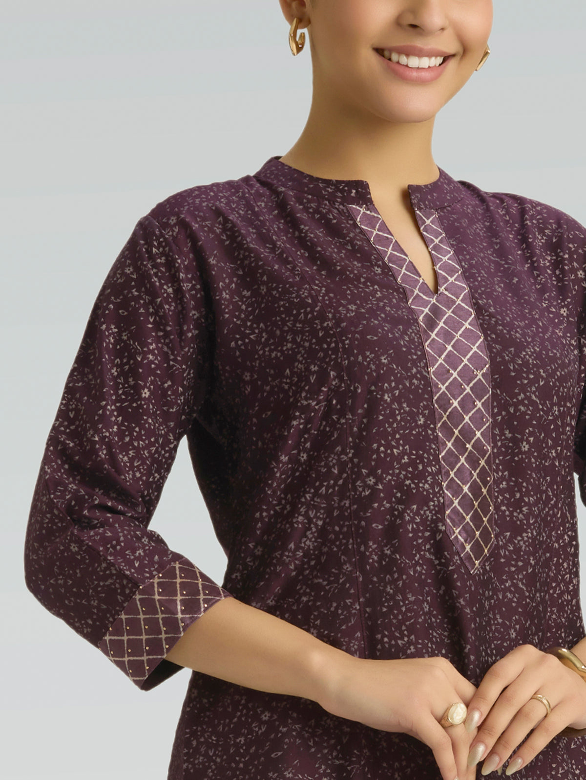 Wine berry kurta front detail: V placket with grid trim and micro print