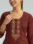 Maroon kurta with floral embroidery on a plain background