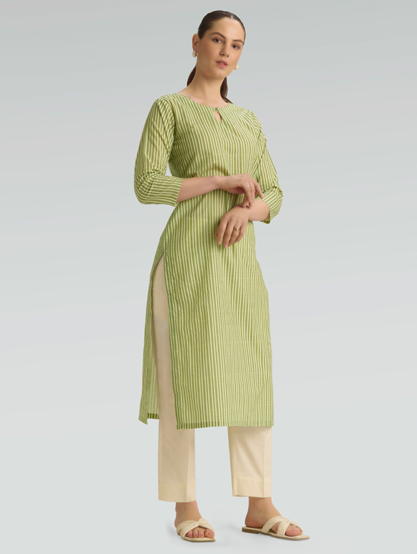 Plus size green leaf print cotton linen kurta for women — side view showing three-quarter sleeves and kurta length
