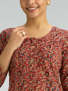 close-up of Kalamkari print and button detailing on a cotton kurta with a round neckline