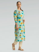 Model wearing mint green floral printed cotton linen kurta styled for casual ethnic wear