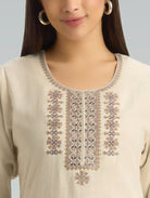 Beige kurta with intricate embroidery on a plain background