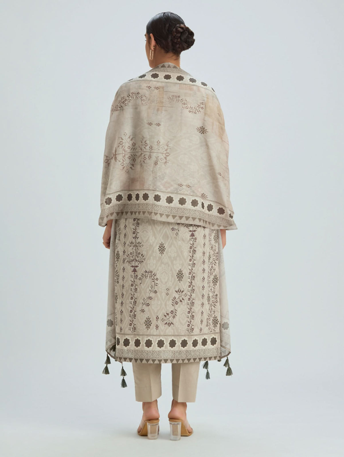 Cotton suit set back view, beige embroidered kurta with plum pattern and tassel edge