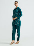 Embroidered teal tunic and tapered pants set, side view with cuffed sleeves